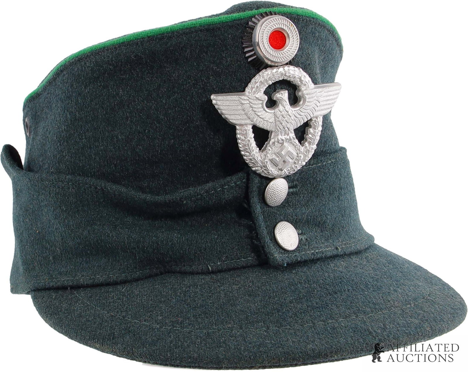 Polizei Feldmutze WWII German Third Reich: A feldmutze for the Ordnungspolizei of the German Third Reich. Green cloth construction with cloth piping. With German national colors cockade and Reichsadler badges. Manufactured by Ludwig Vogele. Si
