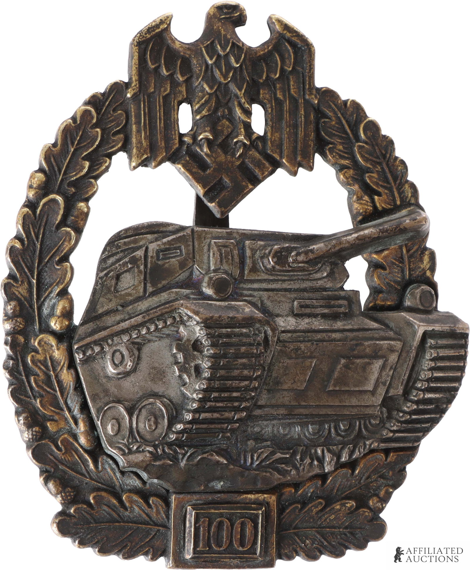 Panzer Assault 100 Engagements Badge Josef Feix: WWII German Panzer Assault 100 Engagements Badge. Solid-struck of tombak. Gilt wreath with semi-hollow panzer attached via two domed rivets. Reverse has tapered vertical pin with crimped round wire ca