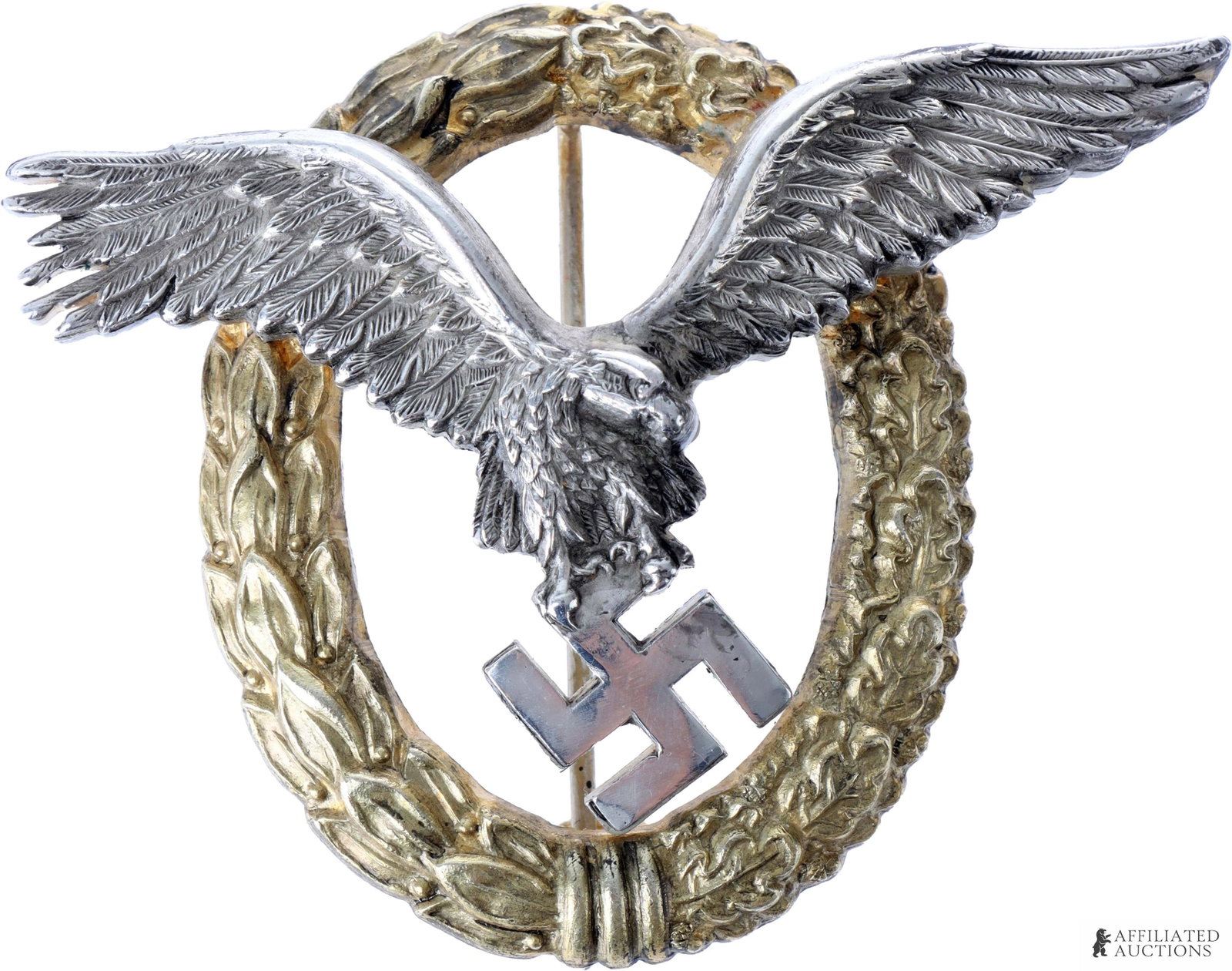 Luftwaffe Pilot/Observer Badge WWII German Reich: A WWII Luftwaffe Pilot/Observer badge, marked on the reverse with 'C. E. JUNCKER BERLIN S.W.' Tombac construction, measures approximately 2.5x2.75 inches. | This lot has a reserve.