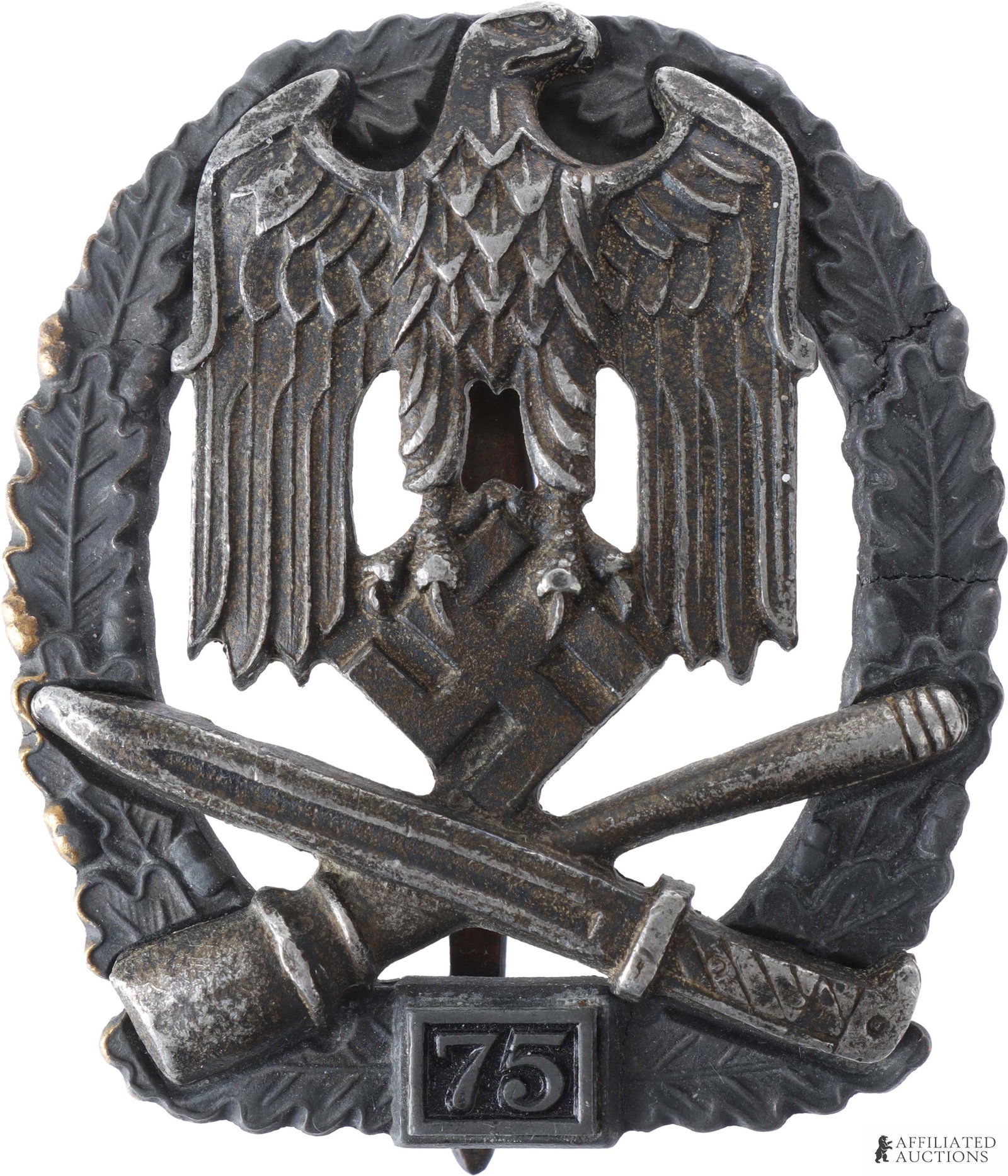 General Assault Badge 75 Engagements German Reich: A WWII German General Assault badge commemorating 75 engagements. Zinc construction. Marked 'JFS' on reverse; measures 2.5 x 2 inches. | This lot has a reserve.