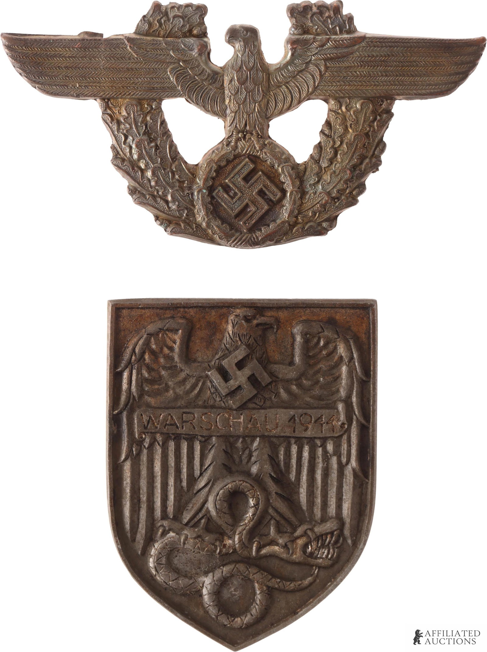 German Warschau 1944 Shield & Police Cap Badge: Heavy type sleeve shield. Large eagle choking snake with its talons. "Warschau 1944." Appears to be bronze construction. The police plate features an eagle clutching a swastika on an oak leaf wreath. 
