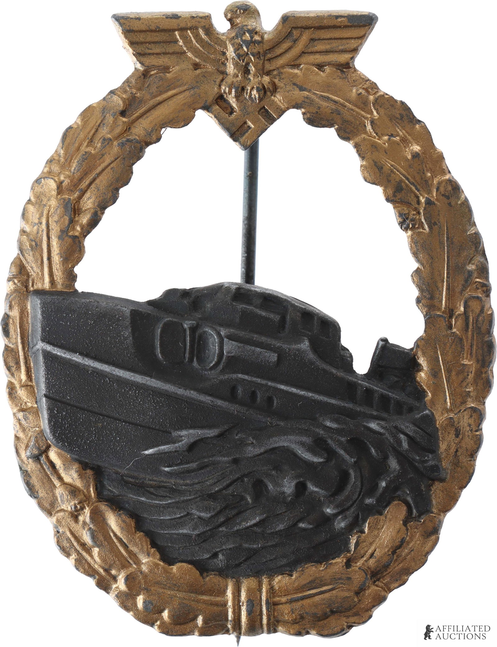 Kriegsmarine E-Boat Badge WWII German Third Reich: A WWII Kriegsmarine E-Boat badge (original design). Zinc construction, measures approximately 2 1/4" x 1 3/4". Unmarked. | This lot has a reserve.