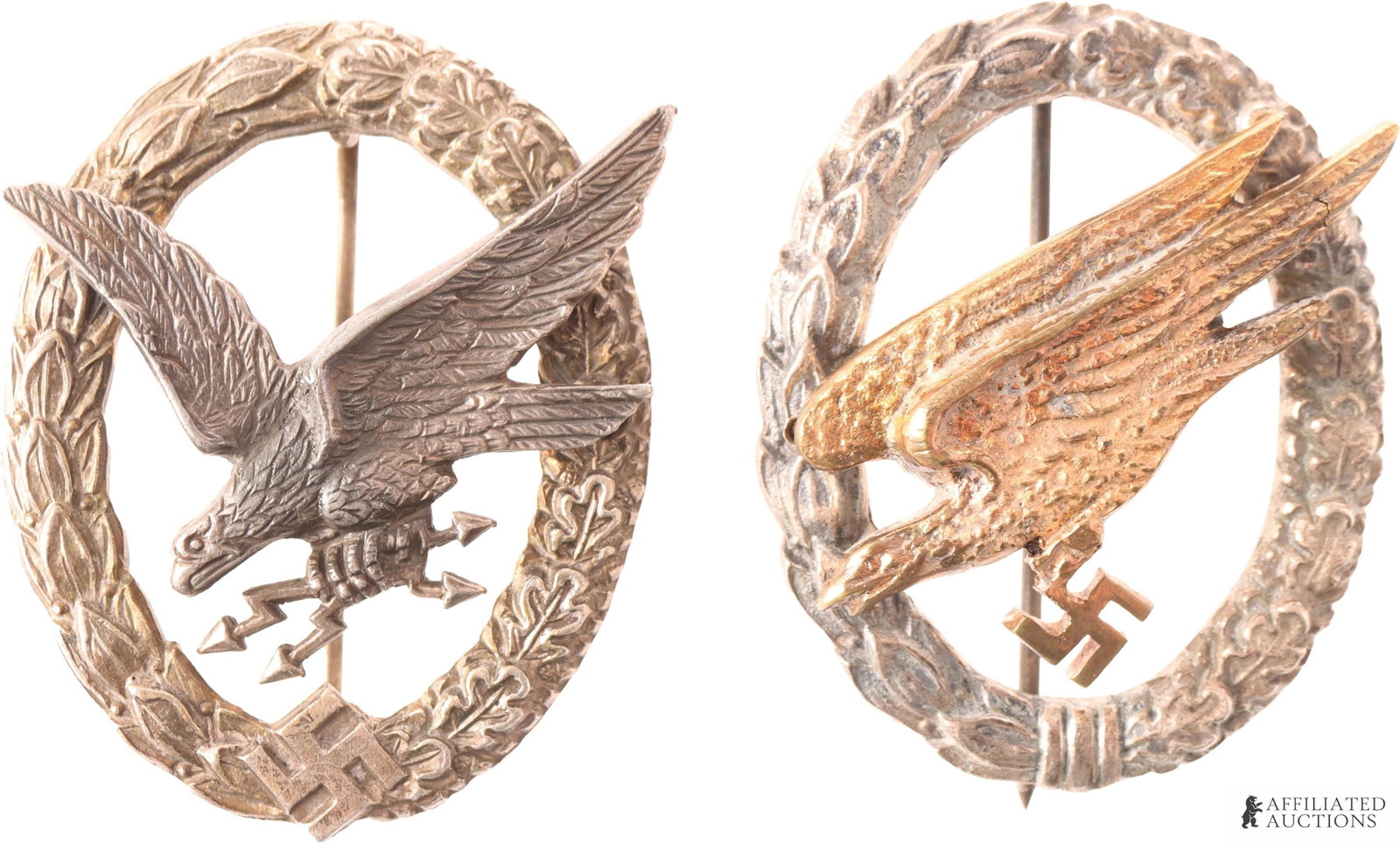 WWII Luftwaffe Paratrooper & Radio Operator Badges: The lot includes one badge depicting a diving eagle clutching lightning bolts in its talons, and a second badge depicting a diving eagle with a swastika, surrounded by a laurel wreath. Dimensions 52.5