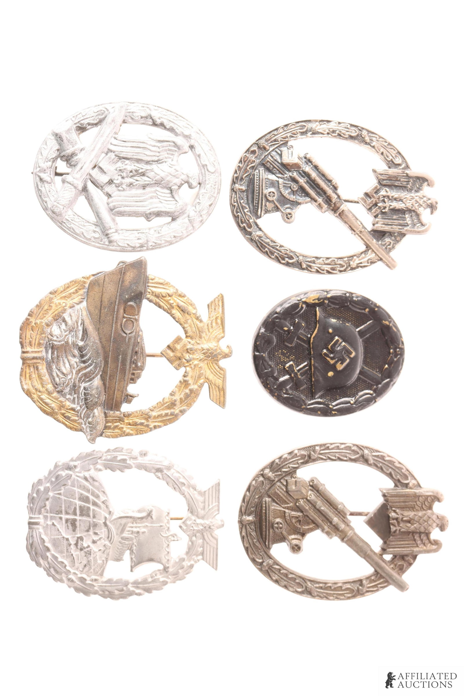 Lot of 6 German WWII Badges: Lot of 6 German WWII Badges. Luftwaffe AA Flak Badge, Black Wound Badge, General Assault Badge, Auxiliary Cruiser Badge, E-boat War Badge.