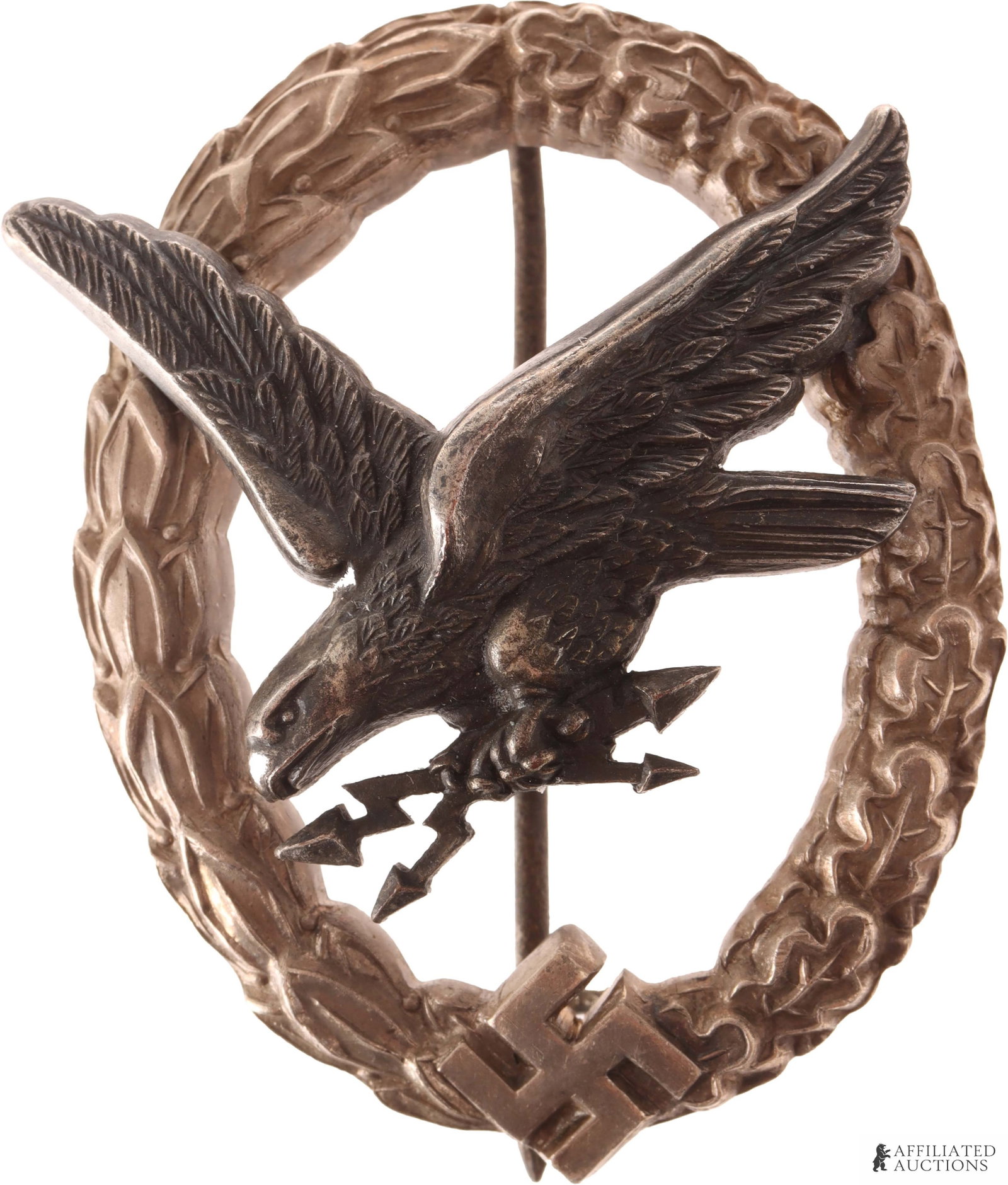 Luftwaffe Radio Operator Badge WWII German: Luftwaffe Radio Operator badge. B & N L. Separate eagle riveted to oak laurel leaf wreath. It measures 52.67mm.