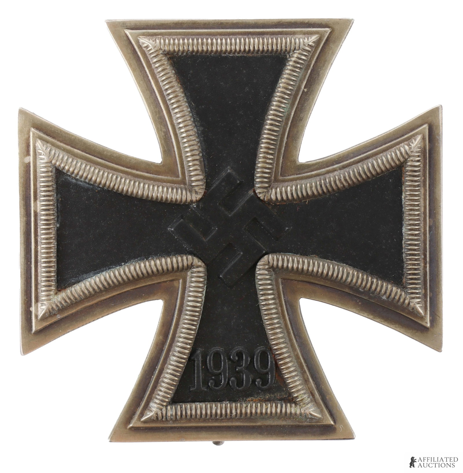 WWII German Iron Cross First Class W Rounded 3: WWII German Iron Cross First Class (EK1). Two piece frame with magnetic iron core. The '3' is rounded, which was the style before the standardized flat top 3. measures 45mm. | This lot has a reserve.