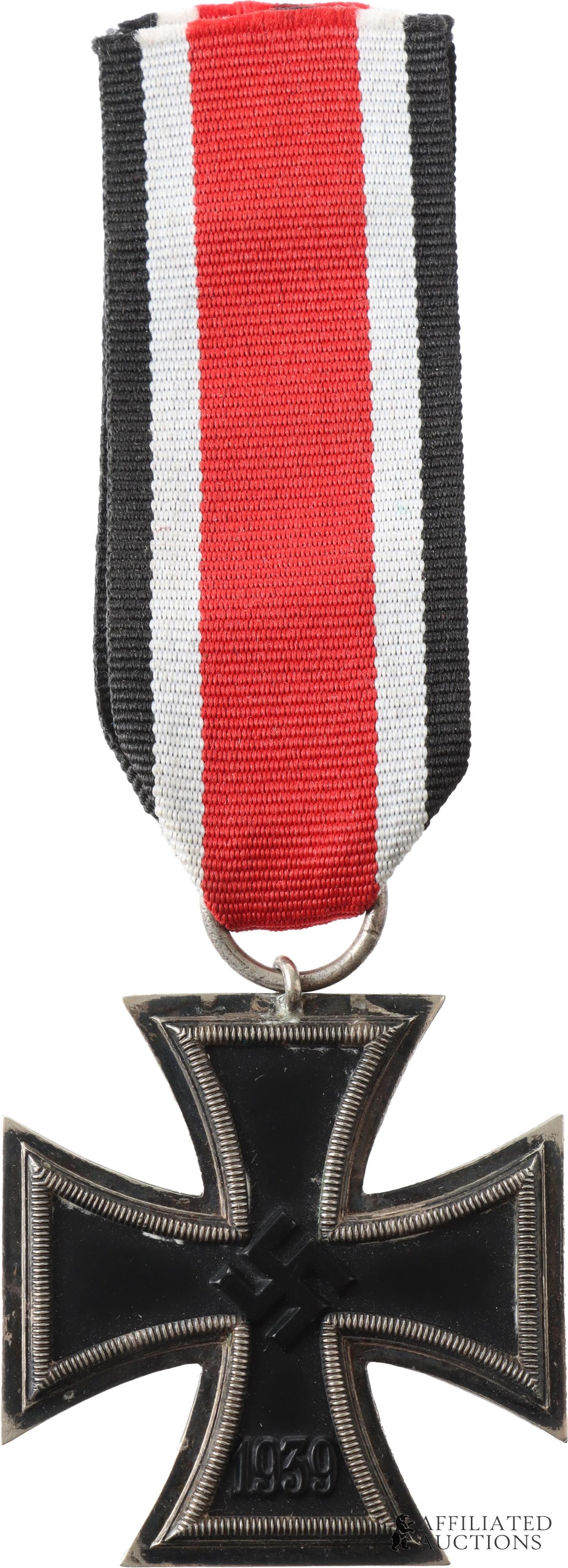 1939 Iron Cross 2nd Class with Ribbon WWII German: 1939 Iron Cross, II Class. Unmarked. Three-piece construction, silver frame with blackened iron core. Width 44mm. Height 47mm. Gross weight 20 grams.