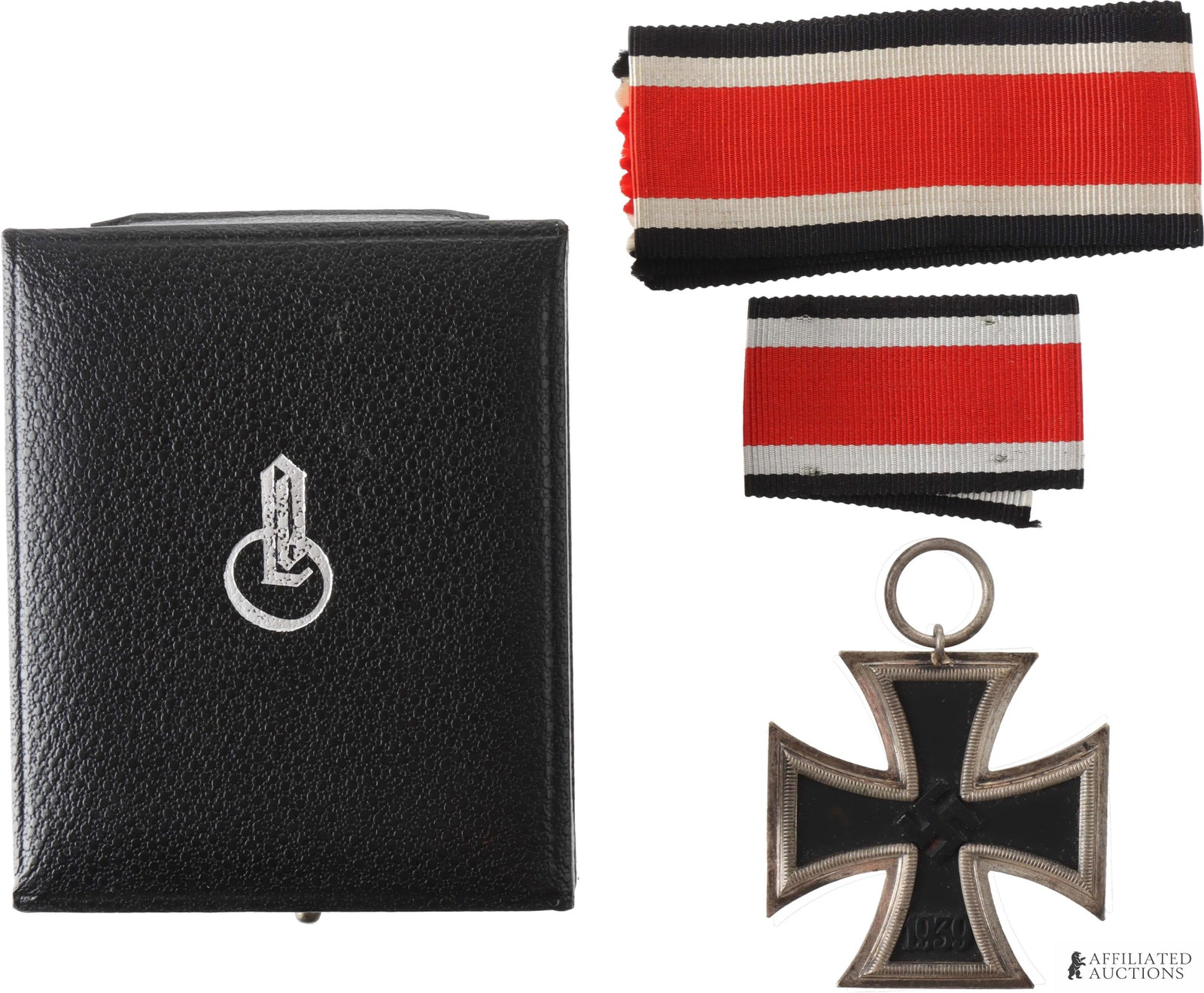 Cased 1939 Iron Cross 2nd Class Klein & Quenzer: Cased 1939 Iron Cross, II Class. Three-piece construction, silvered frame with blackened iron core. Suspension ring marked "65." Height 48.25mm. Width 44.62mm. Gross weight 17.4 grams.