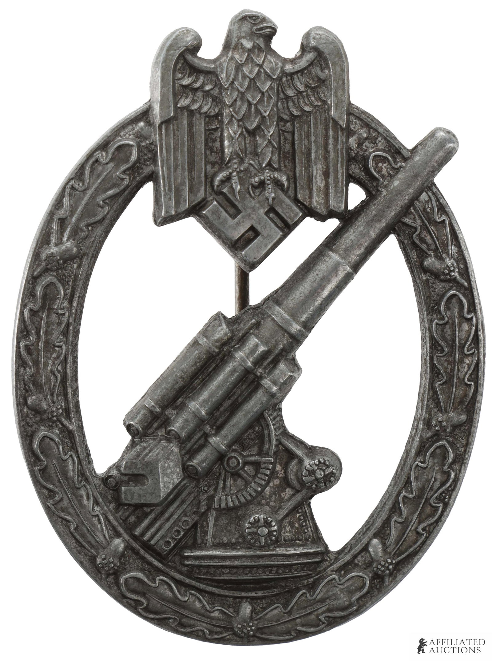 Heer Artillery Flak Badge WWII German: Mid war zinc construction. Stamped 'HA" for Hermann Aurich. Measures 60mm x 44.5mm. | This lot has a reserve.