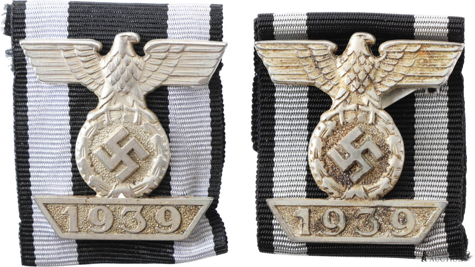 Cased 1939 Spange for Iron Cross Lot of 2: Lot of two (2) cased 1939 spange for Iron Cross. Both in cardboard boxes finished in grey faux leather, one box marked "J.E. Hammer & Sohne Geringswalde." Both stamped "L/12" on reverse with four shee