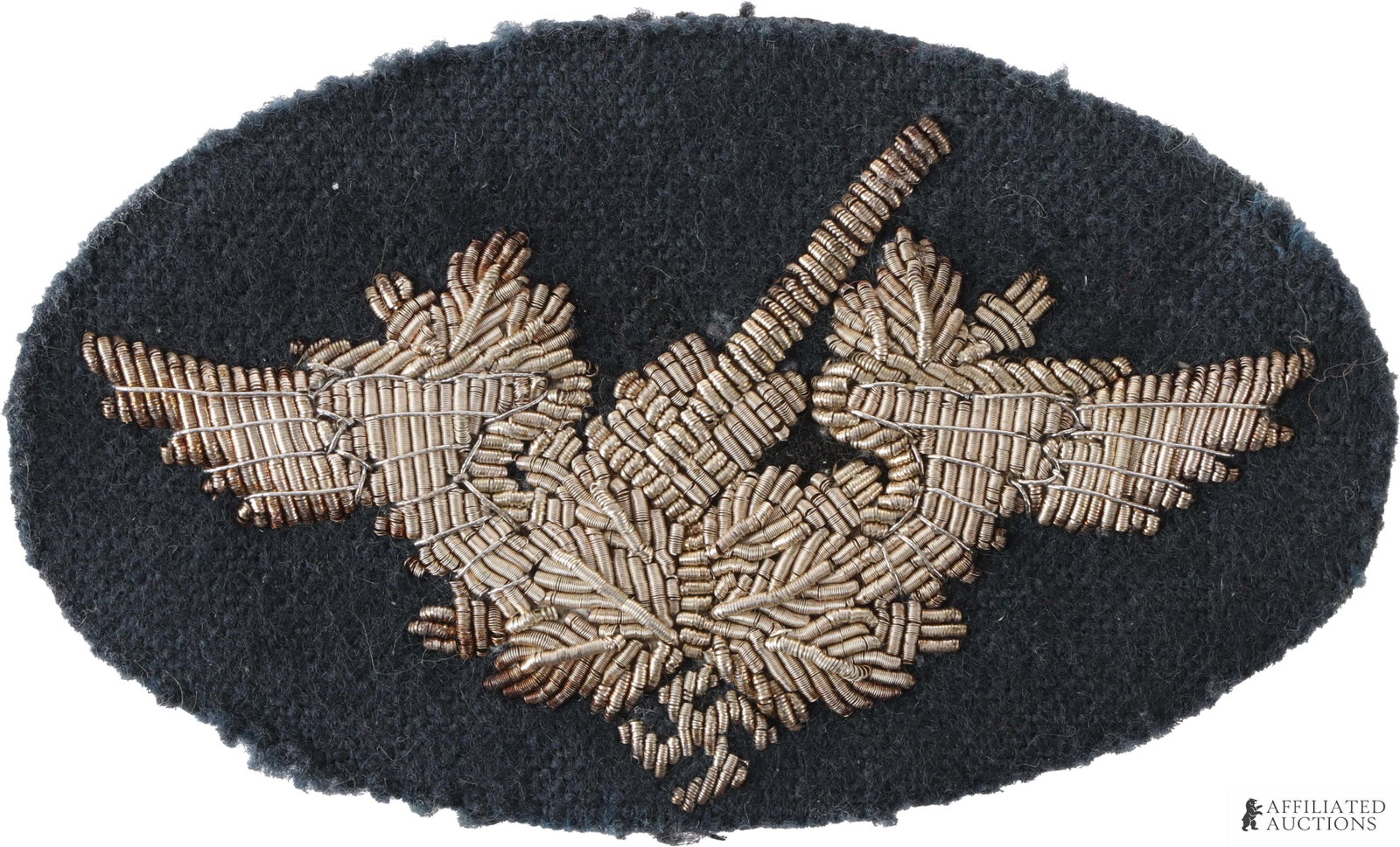 Luftwaffe Artillery Flak Sleeve Patch WWII German: WWII German Luftwaffe Flak Artillery sleeve patch. Cloth construction with silver bullion embroidered flak insignia. It measures 73.45 X 34mm. Very good condition. Some fluorescence on interior