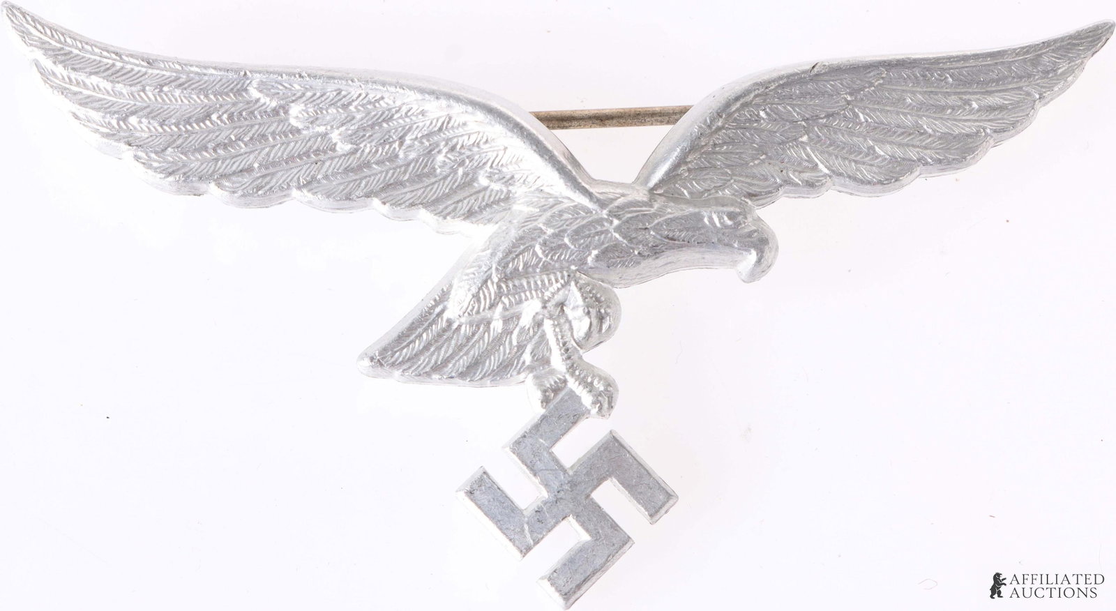 Luftwaffe Breast Eagle Pin-Back WWII German Reich: A pin-back Luftwaffe breast eagle; this style of breast eagle was worn with summer/tropical uniforms. Marked on reverse with 'A' manufacturer's mark, indicating production by F.W. Assmann & Sohne. Wei