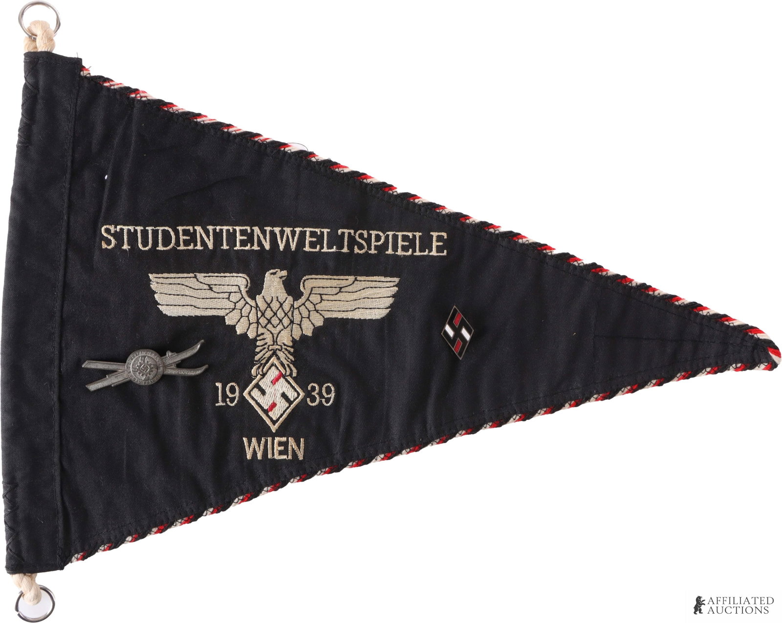 WWII German Student League Pennant Flag: German student league pennant from Student world games in Vienna in 1939. Has a student league enameled members pin and ski participant badge attached. Double sided. Pennant measures 9 x 14 inches. | 