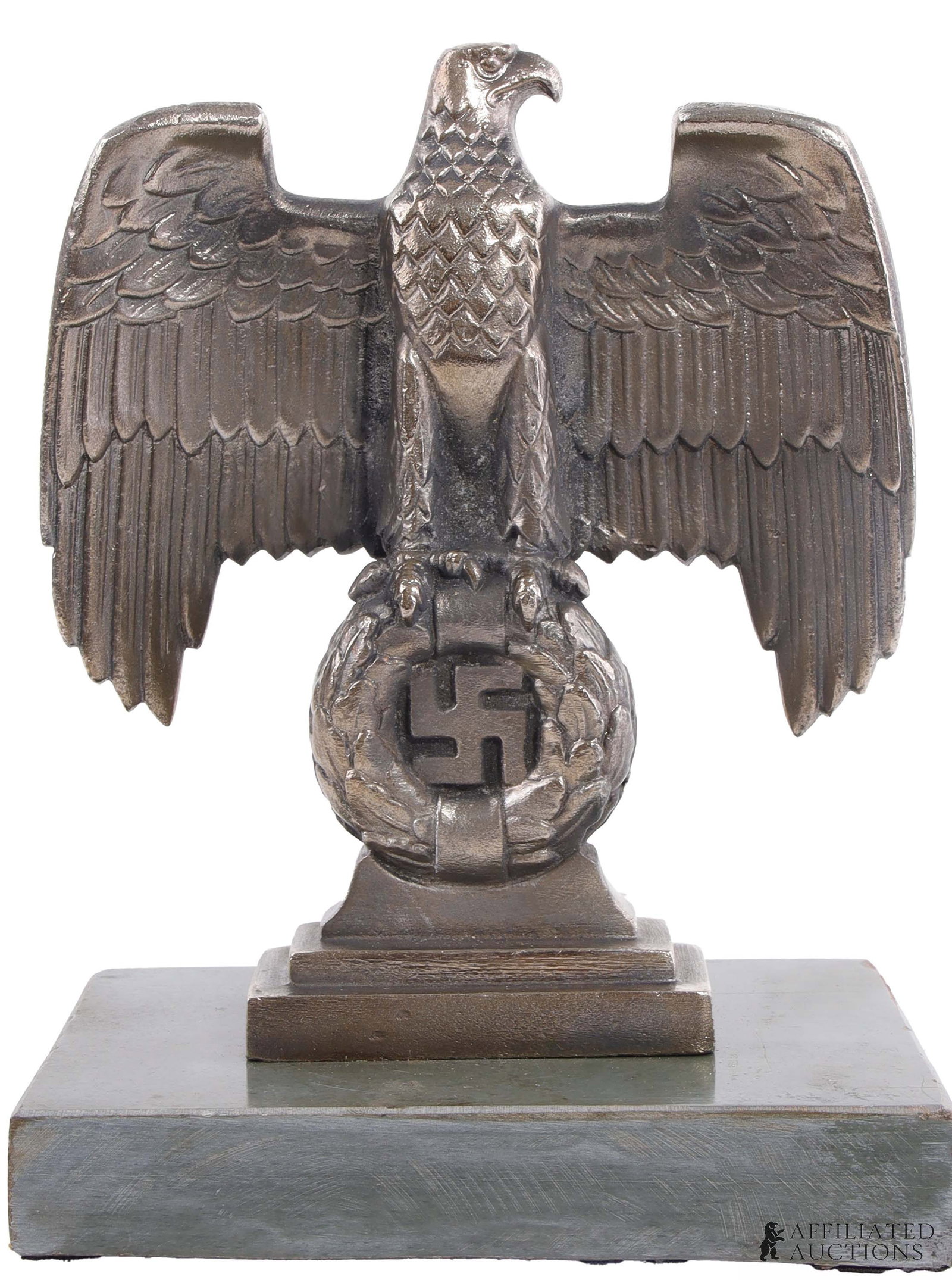 Desk Reichsadler WWII German Third Reich: A desk reichsadler, featuring an eagle and swastika. This item stands 7.9 inches tall with a 3.9x5.9 inch base.