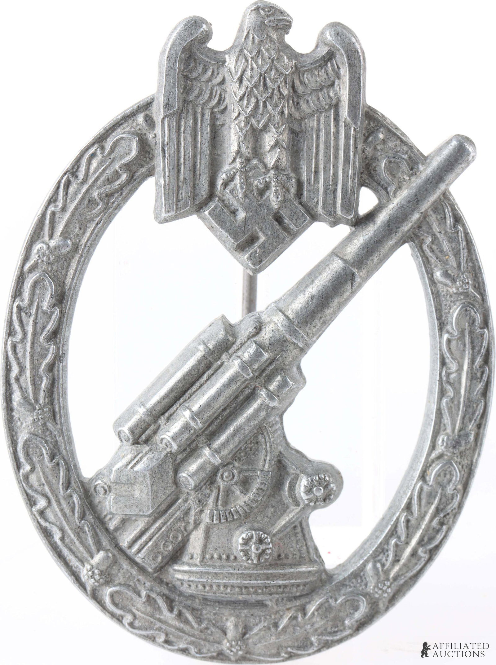 WWII Heer Flak Badge German Third Reich: Die struck, solid backed, alloy construction badge with a silver wash, features an embossed, vertically oval, oak-leaf wreath with a Wehrmacht style eagle, with down-swept wings, clutching a canted sw