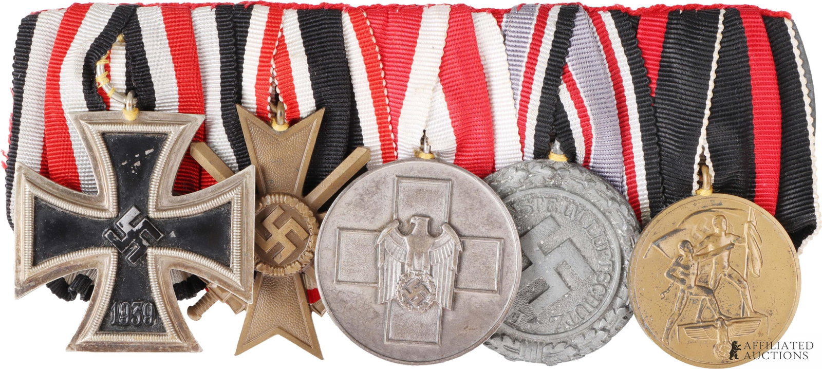 Spange with Iron Cross Second Class & Other Medals: A medal spange with an Iron Cross second class. Magnetic core, tests positive for silver, with visible seam. Cross is sewn into spange, making proper identification of the cross's manufacturer impossi
