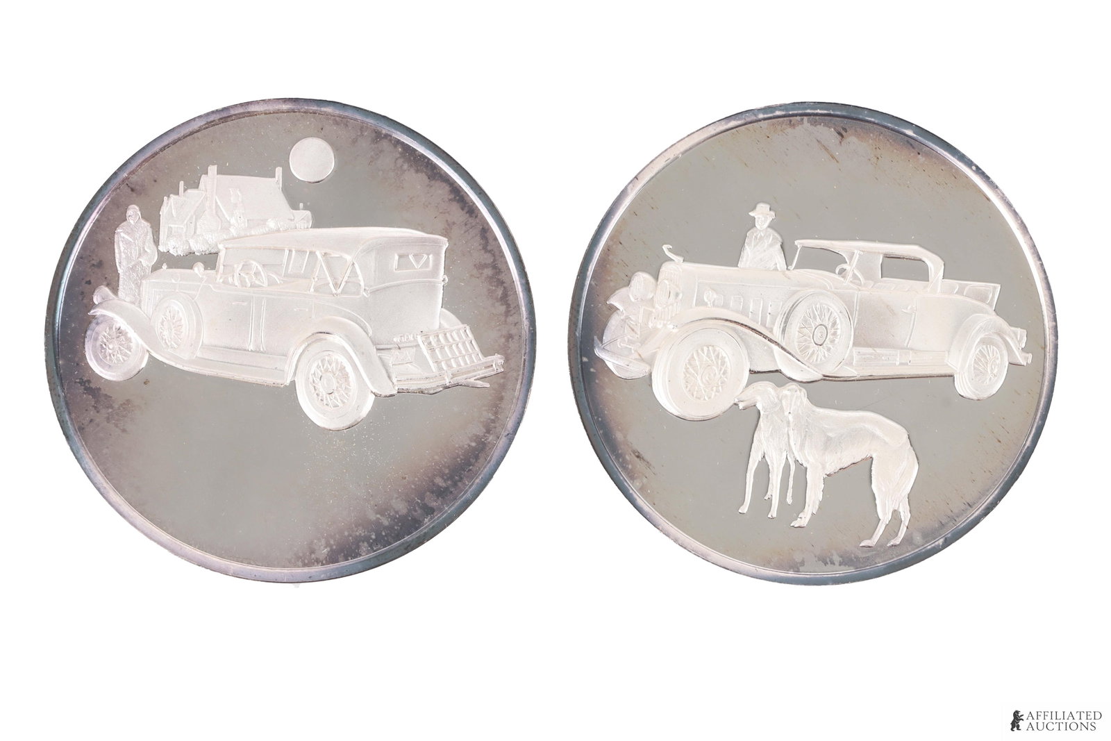 Automobiles .999 Fine Silver Medals 4.24 Ozt Lot 2: Two coins, each representing a different classic automobile. 1) Pierce-Arrow Model I33. 2) Cadillac Fleetwood V-J6. Each coins weighs 66 grams, leading to a combined net weight of 132 grams (4.24 troy