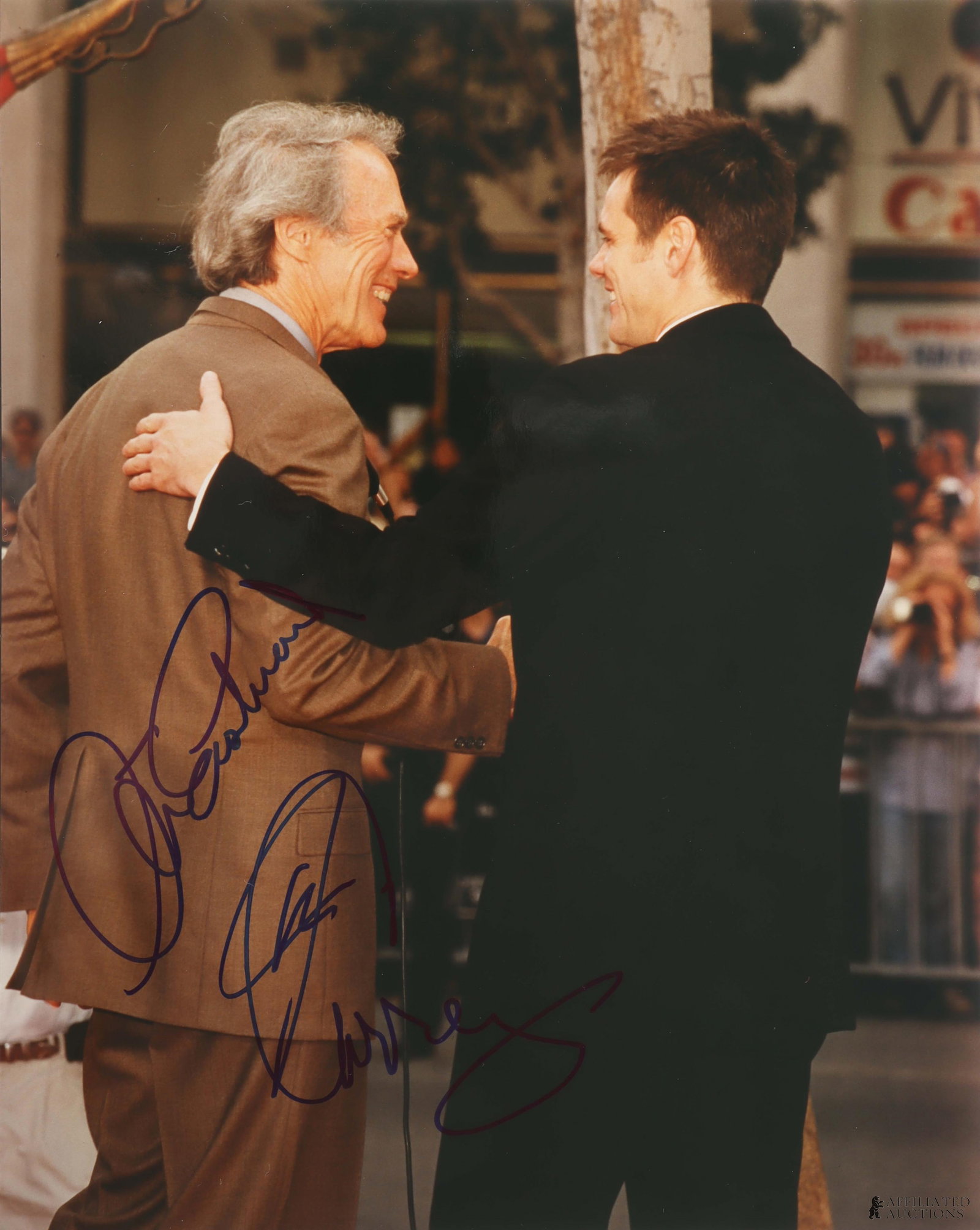Clint Eastwood & Jim Carrey Signed Candid Photo: A photograph of Clint Eastwood and Jim Carrey interacting at the 2012 AFI Lifetime Achievement Awards commemorating Shirley MacLaine, signed by Jim Carrey and Clint Eastwood. This autograph was collec