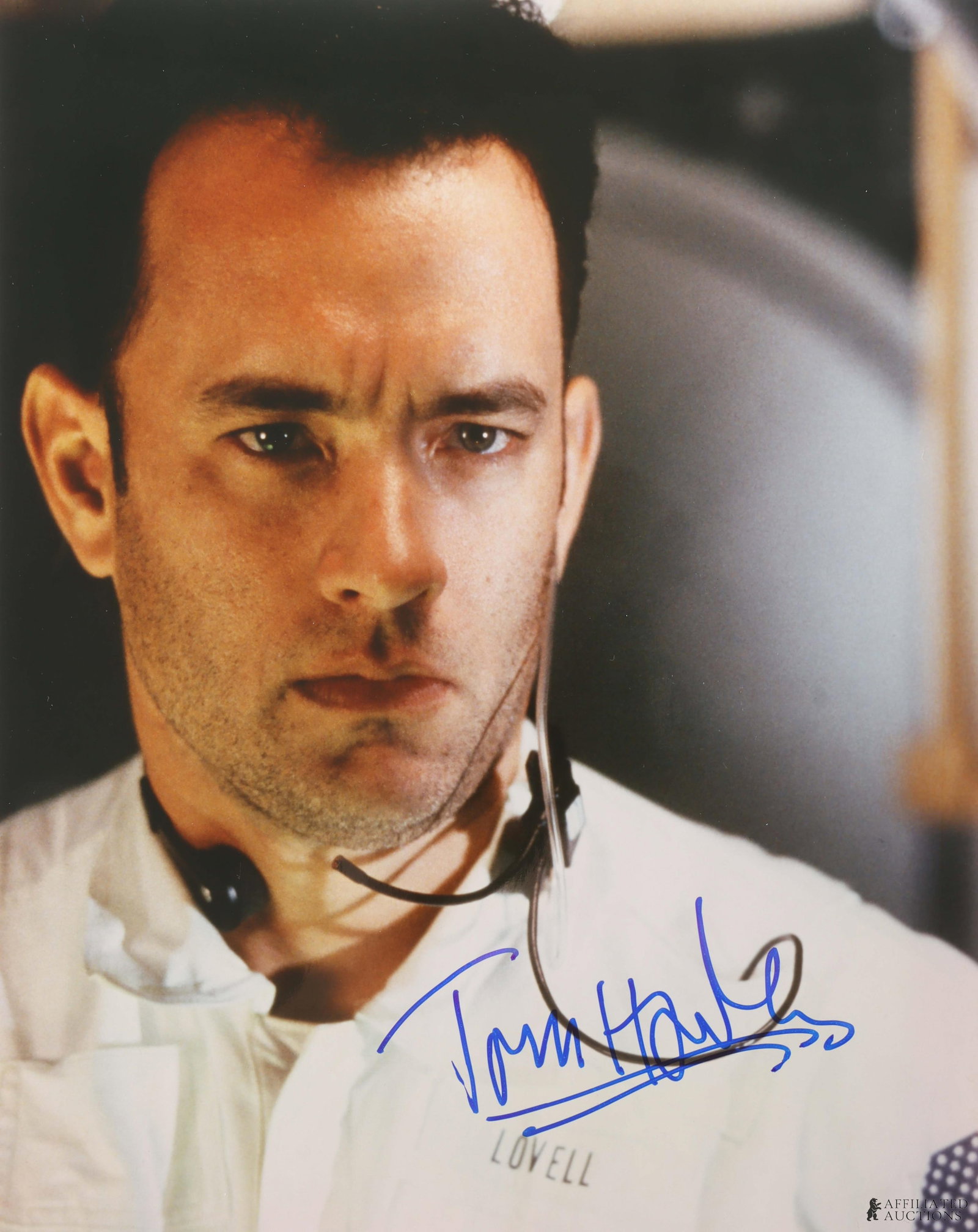 Tom Hanks Signed Photo Apollo 13: A movie still from the film Apollo 11, signed by actor Tom Hanks. This autograph was collected for James Reeves, who used a staff of agents to acquire signatures from celebrities while running his aut