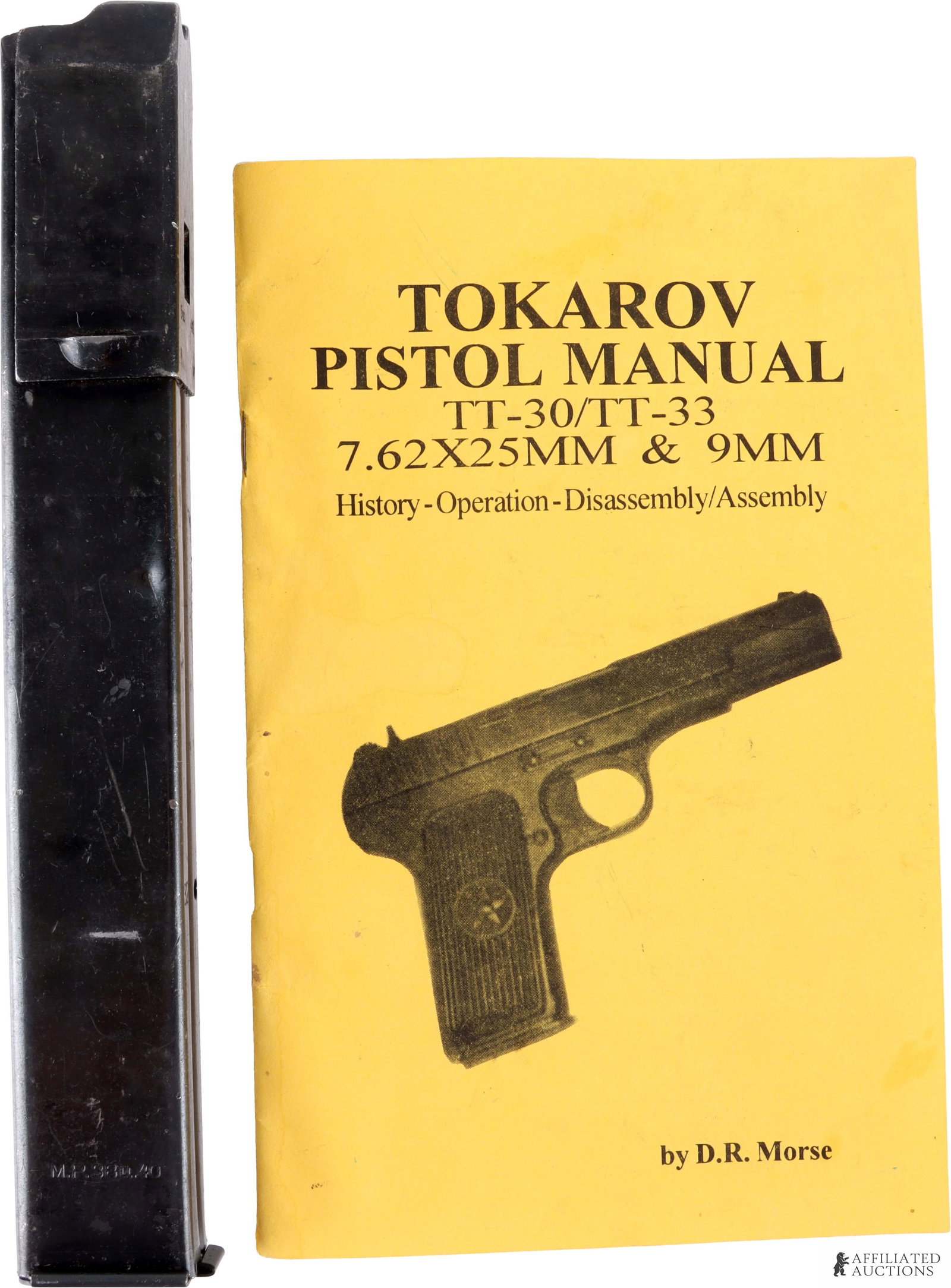 1941 MP38u40 32rd Magazine & Vintage Pistol Manual: This lot includes the following: 1) 32-round, slab-sided detachable magazine for a 1941 German MP38u40 SMG. Marked with maker code fxo, attributed to C.G. Haenel (C.G. Haenel Waffen- und Fahrradfabrik
