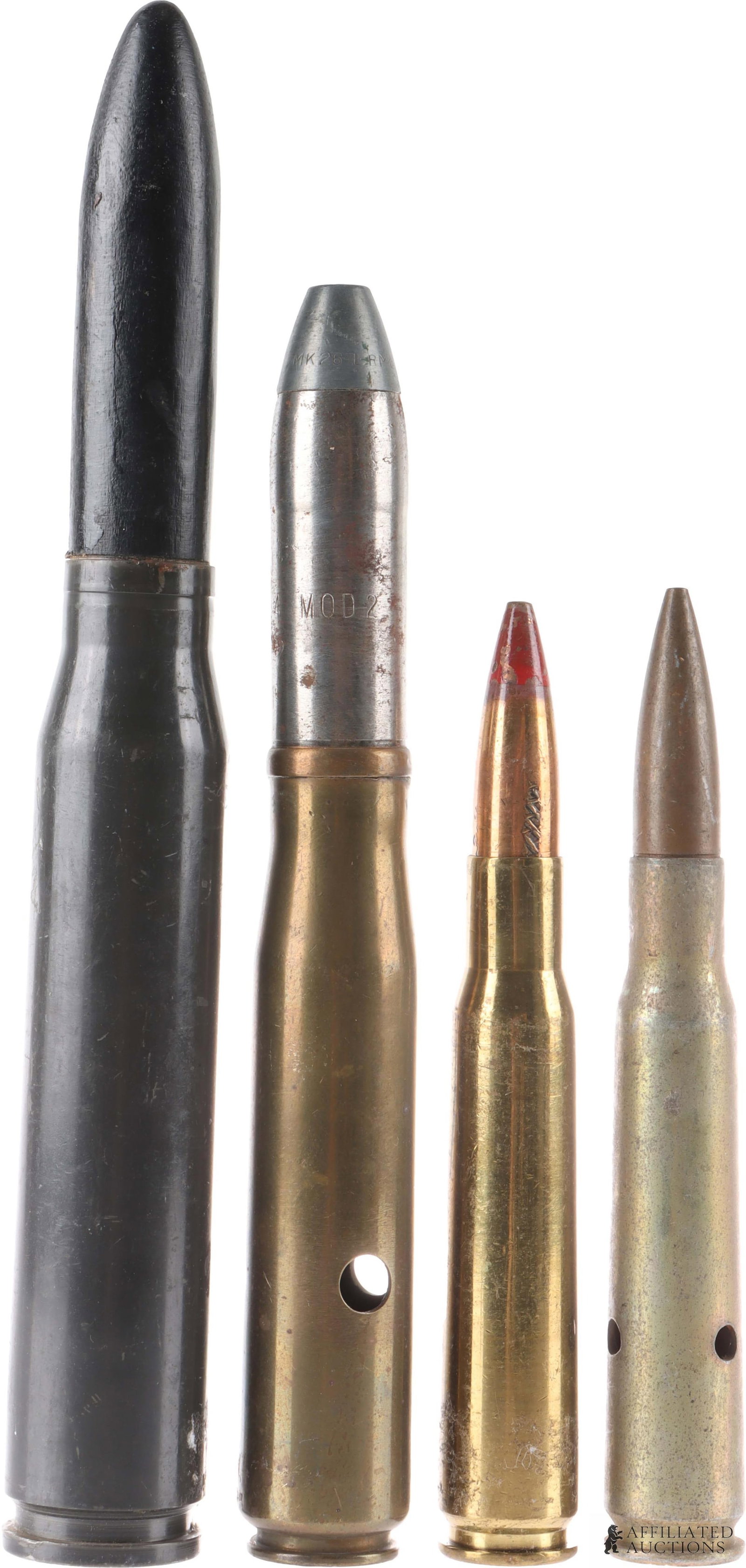 Vintage Large Caliber Ammo Cartridge Lot of 4: A lot of four vintage large-caliber ammunition rounds. Includes 1) an inert .50 BMG tracer round, 2) a .50 BMG dummy round, 3) a 1943 20mm dummy round, stamped on the bottom with the manufacture year,