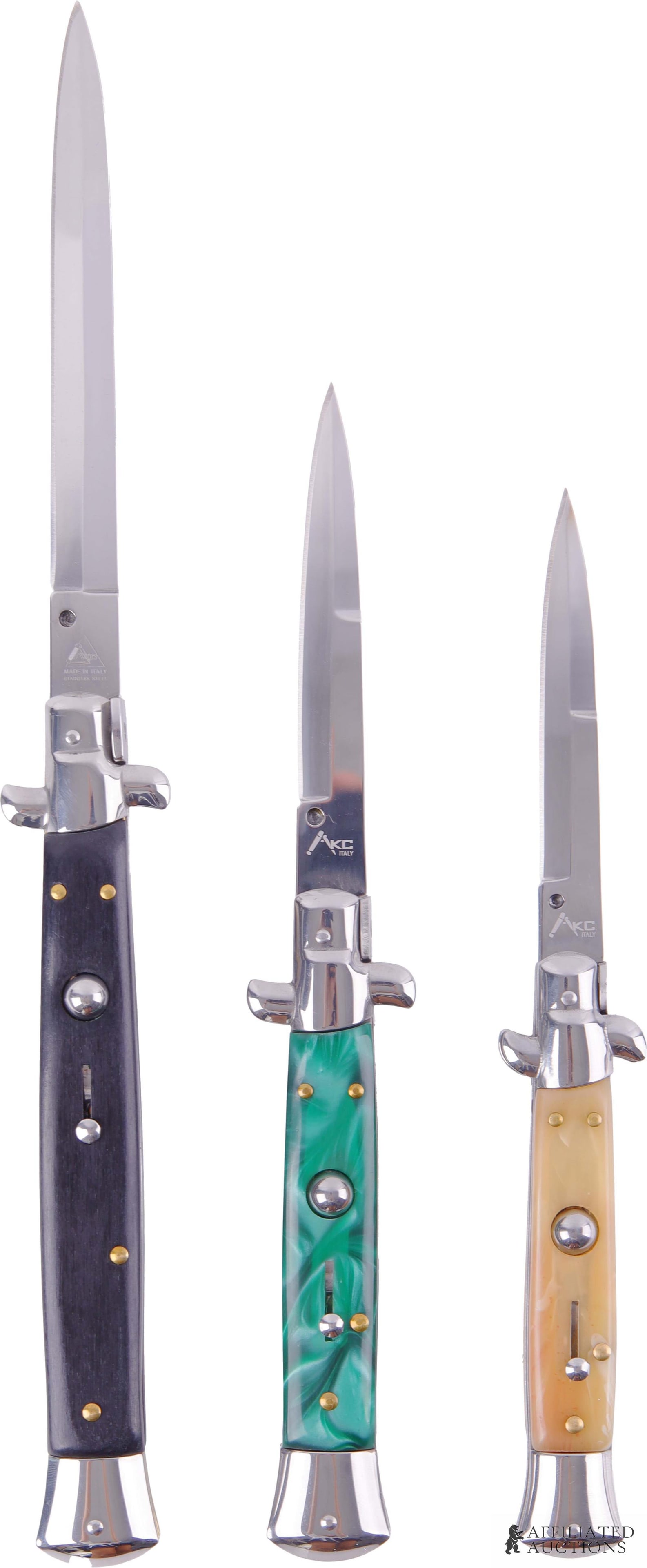Lot of 3 AKC Italian Switchblades: Lot of Three (3) AKC Italian-made switchblades. Green opalescent plastic grip knife measures 10 inches open with a 3.5 inch blade. Honey horn plastic grip knife measures 9 inches open with a 3.25 inch