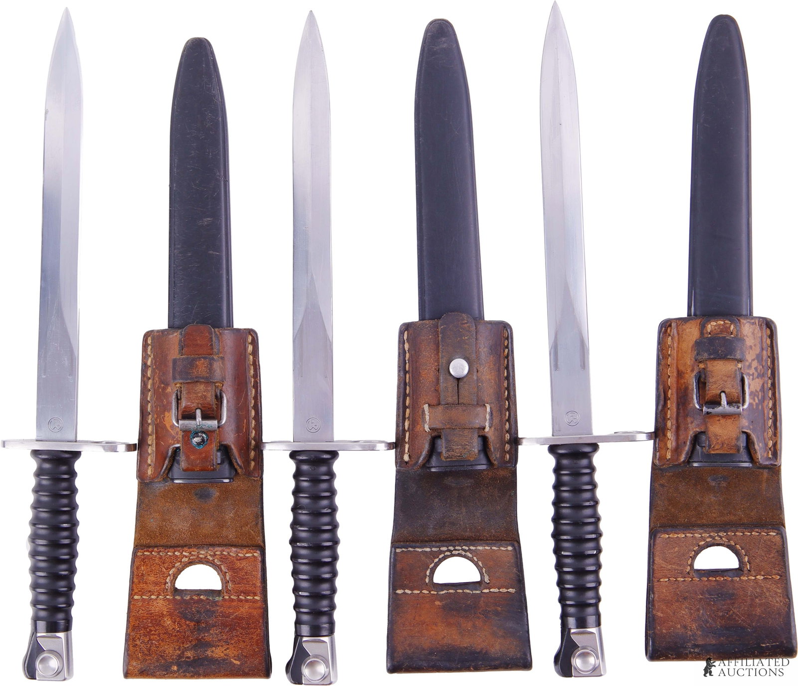 Lot of 3 Swiss M1957 Bayonets W/ Scabbards & Frogs: Lot of 3 Swiss M1957 Stgw. 57 Wenger bayonets with scabbards and frogs. The ricasso features stamp marking Wenger on one side and the Bern acceptance stamp on the reverse. Designed for the Swiss SIG S