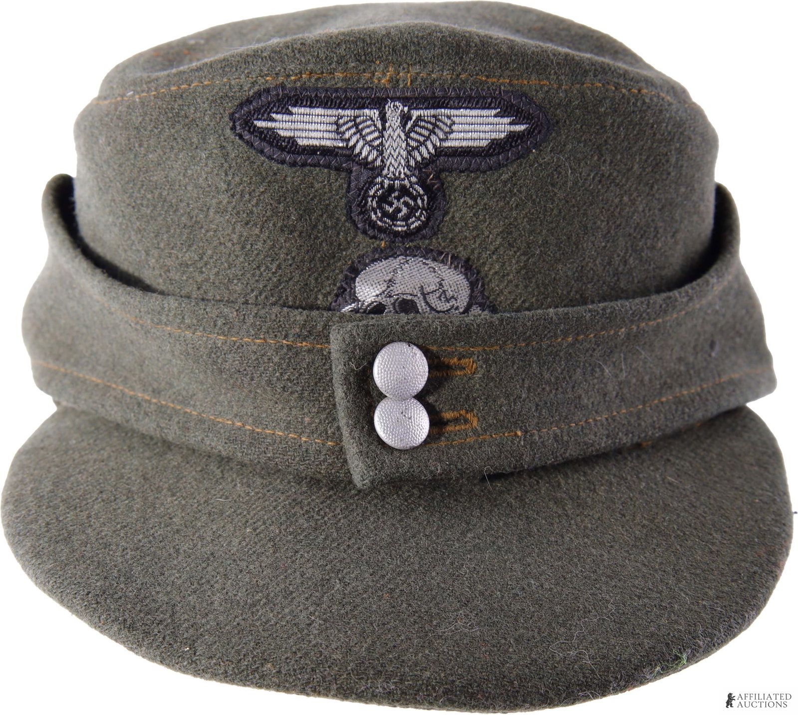 SS M43 Field Cap EM/NCO Stacked Flat Wire Insignia: Waffen-SS enlisted-pattern M43 field cap in field-grey wool. | Front has stacked Reichsadler and Totenkopf insignia machine-woven in silver flat wire thread. Exposed edge zig-zag stitched directly to 