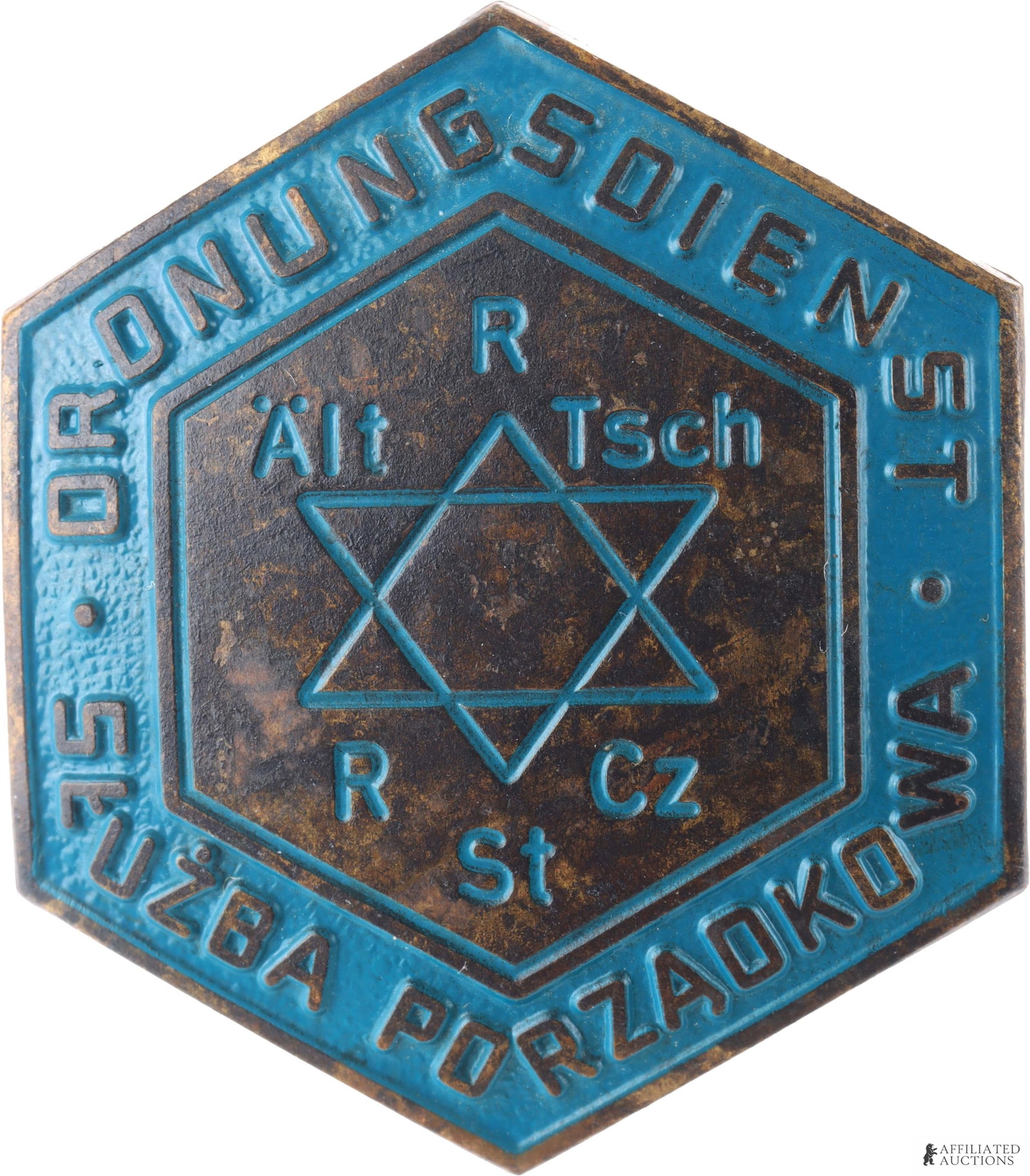 WWII Warsaw Ghetto Jewish Cap Badge: Warsaw Jewish ghetto, a Jewish "Ordnungsdienst" hat badge. Measures 1 1/2 inches or 41mm. The badge has a screw thread and brass backing plate. The design on the badge comprises a Star of David picked
