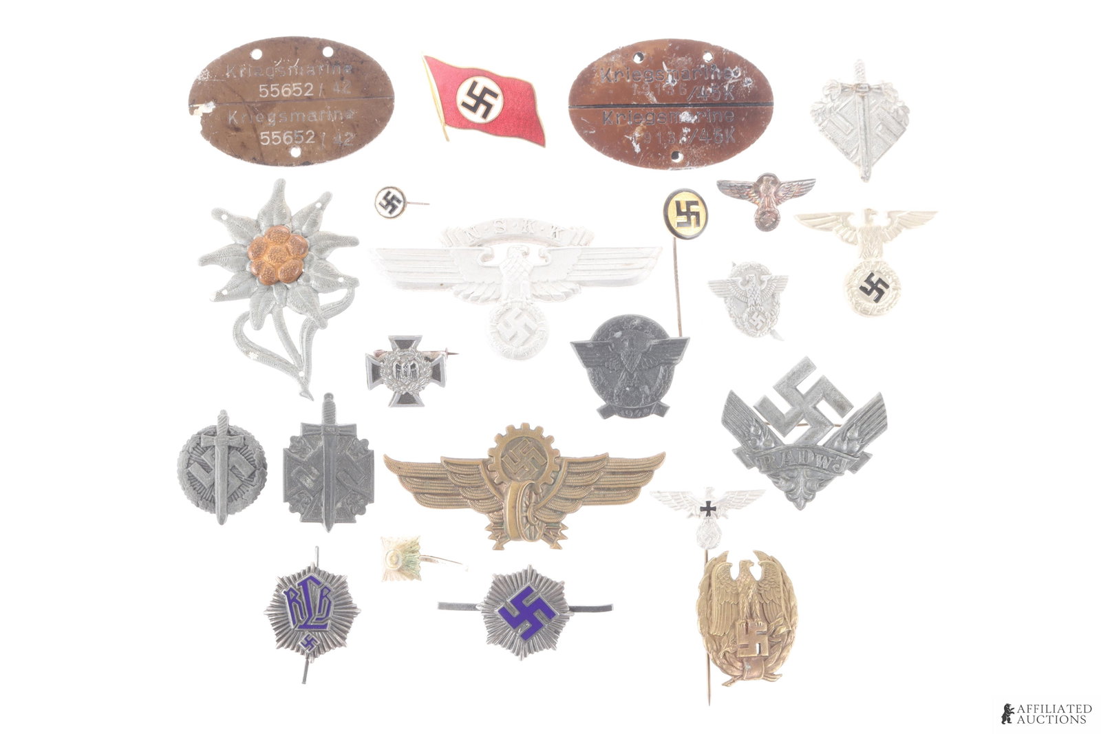 Lot of 22 WWII German Third Reich Pins & Badges: Featured in the lot are RLB pins, Edelweiss Pin, NSKK cap badge, Kriegsmarine dog tags, SA/SS dagger grip eagle pin, and more.