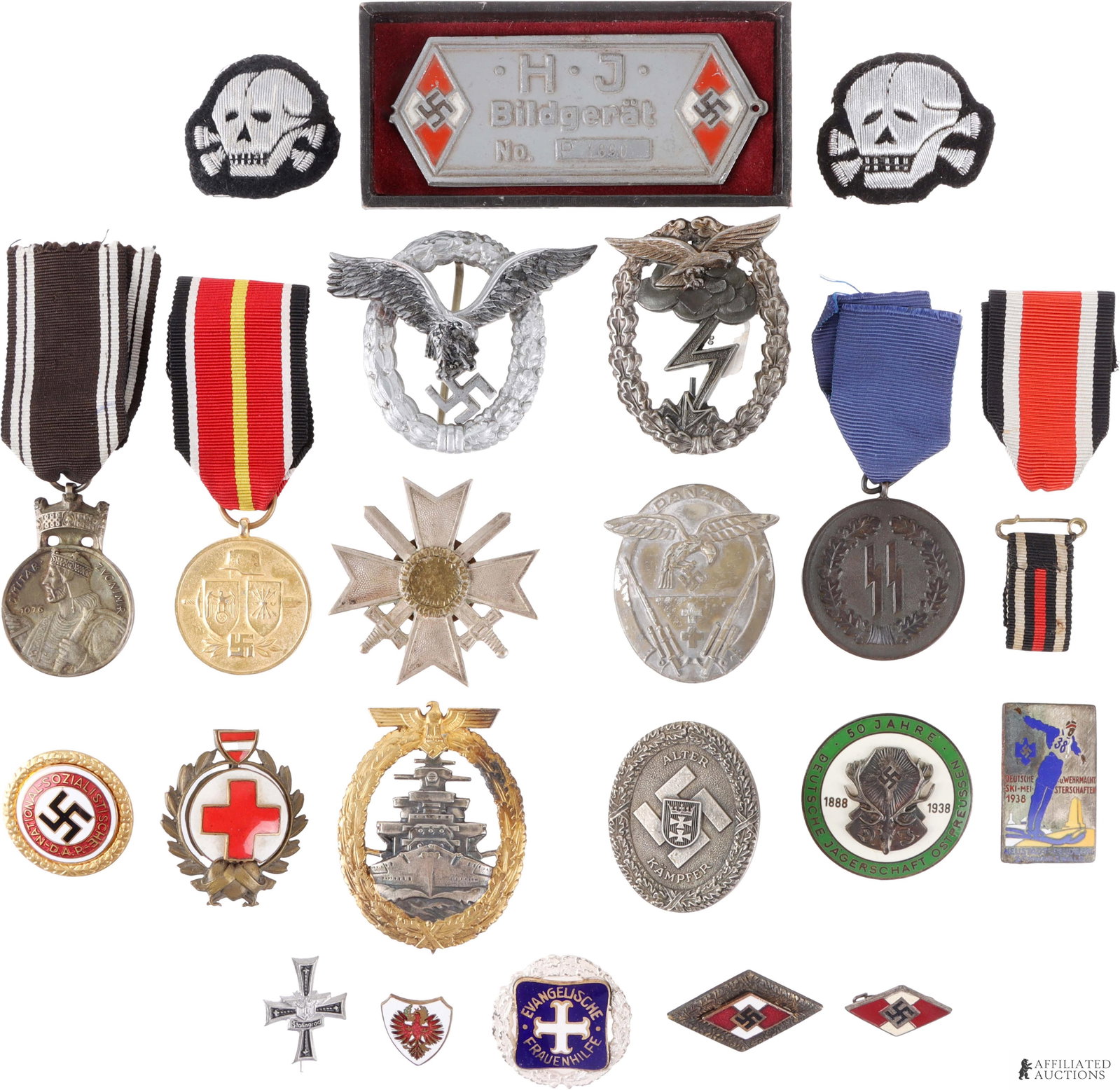WWII German Badge Collection Lot of 20 Pcs: Lot of 20 German WWII Badges | Lot contains Hitler Youth projector label, Luftwaffe ground assault badge, Kriegsmarine high seas fleet war badge, Spanish blue division volunteer medal, German Hunting 