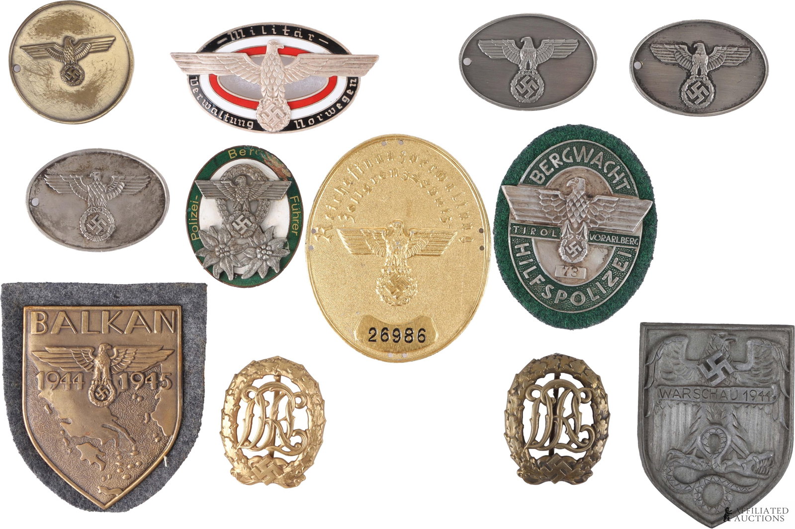 WWII Reproduction German Badges and Police Discs: Personal collection of 12 German Police badges and discs. Lot contains WWII Balkan campaign shield, Gestapo warrant disc, secret field police disc, military admin of Norway breast badge, police mounta