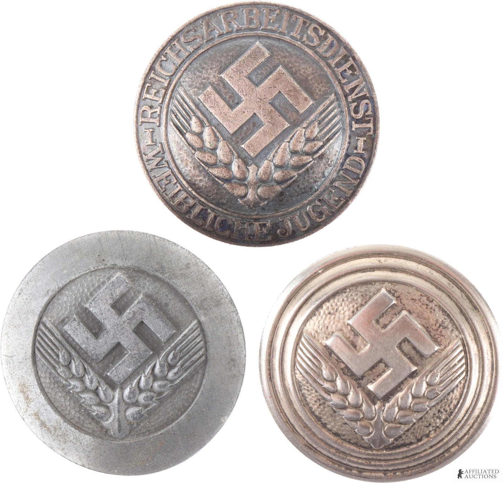 WWII German Female RADwJ Badge Lot of 3: Nickel over steel badge marked 'Assmann' '39' and 'RJAD.' The Tombak badge is marked 'Ges Gesch' 'RJAD' and '37'. The zinc badge is marked but difficult to discern due to wear. They measure 44mm.