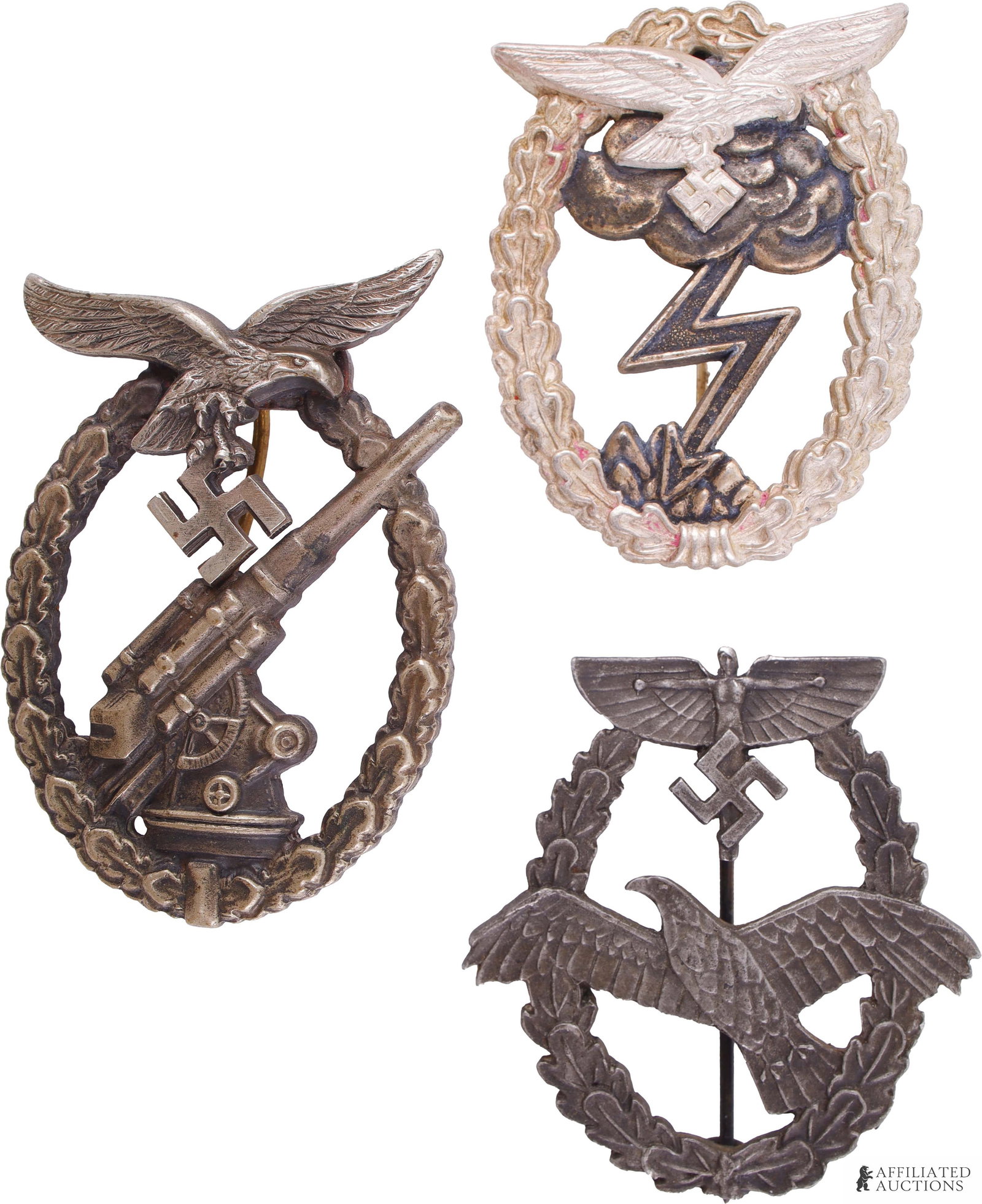 3 Luftwaffe Badges WWII German Reich: Lot features an NSFK Powered Aircraft pilot badge, Luftwaffe flak badge, and Luftwaffe Ground Assault badge. Measurements are 56mm. All tombak construction.