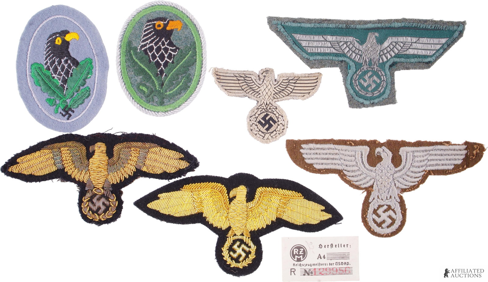 A Selection of WWII German Eagle Patches: Lot of seven (7) German Eagle patches. Includes Army breast eagle, Sniper's badge, Sniper's badge 2nd class, army tropical breast eagle, RMBO sleeve eagle and two (2) Kriegsmarine officer/NCO breast e