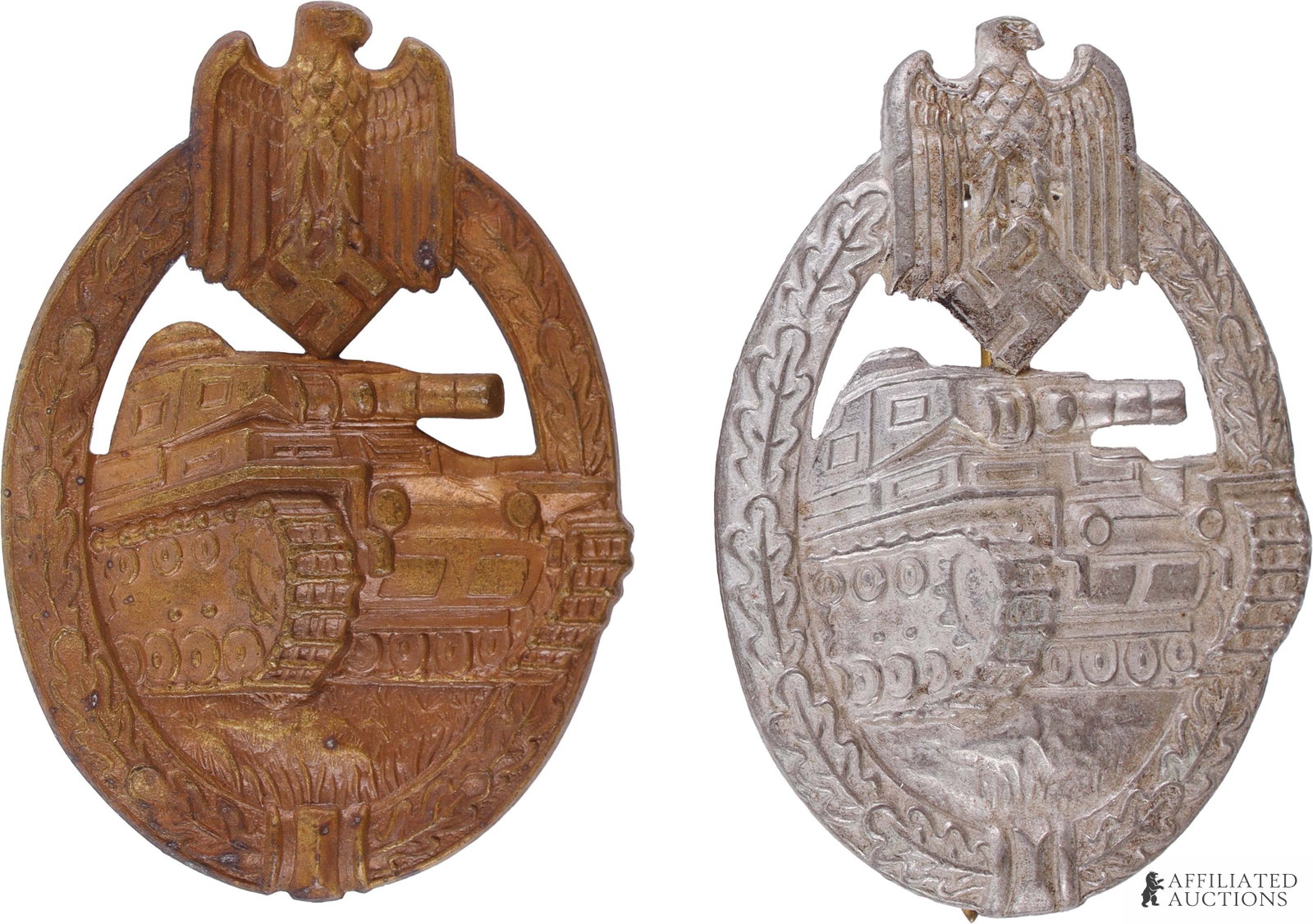 German Military Badges Lot of 2 WWII Third Reich: A lot of two WWII German Panzer Assault badges, one bronze and one silver. The bronze badge is marked 'R.S. & S.' on the reverse below the pin and weighs 40 grams, while the silver badge is marked 'R.