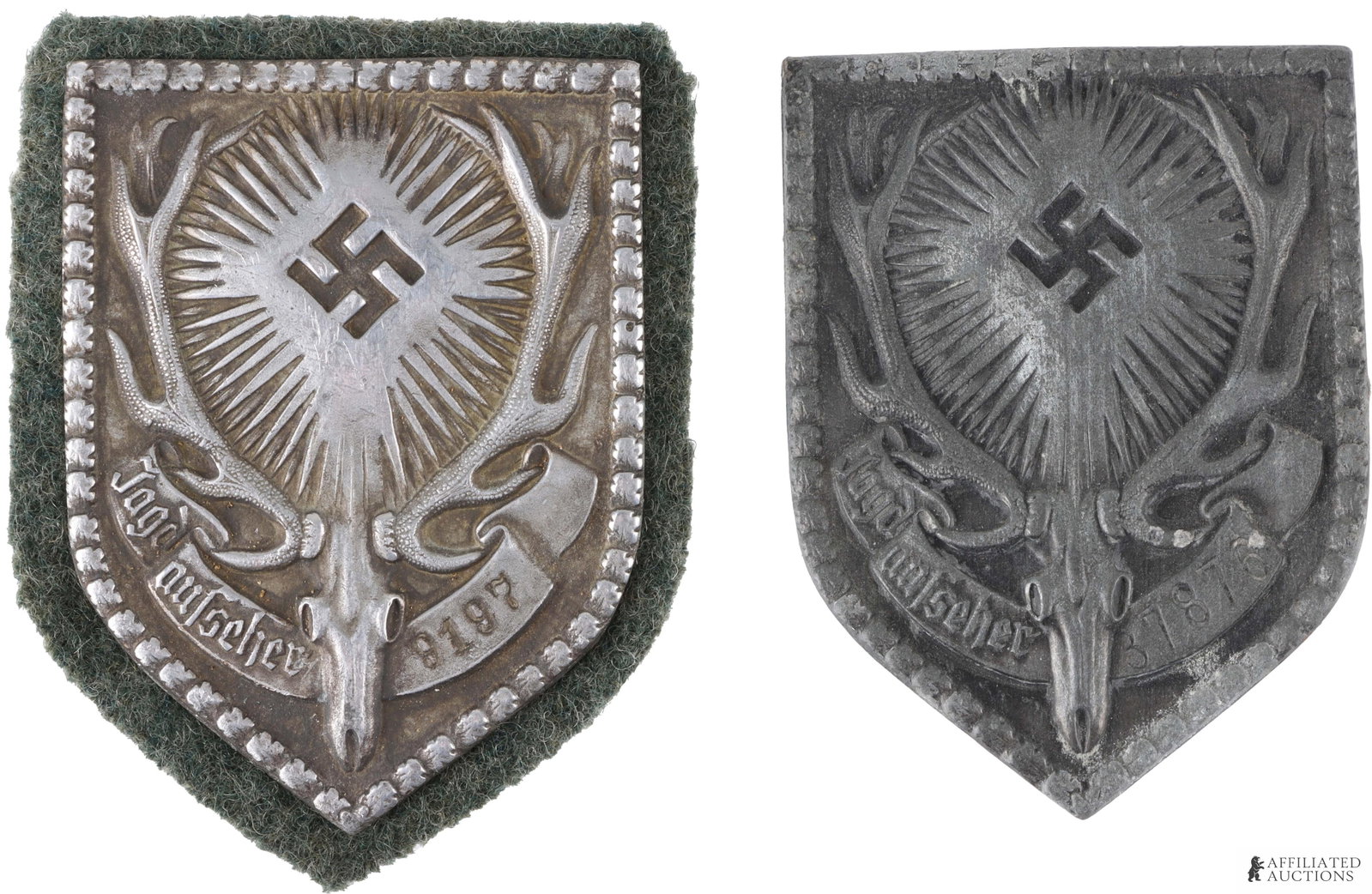 VTG WWII Pin Badges Lot of 2 German Third Reich: A lot of two WWII-era German pin badges. Both badges are unmarked Jagdaufseher (Game Warden) badges; one is edged with green felt and weighs 14.5 grams, while the other lacks felt and weighs 12.5 gram