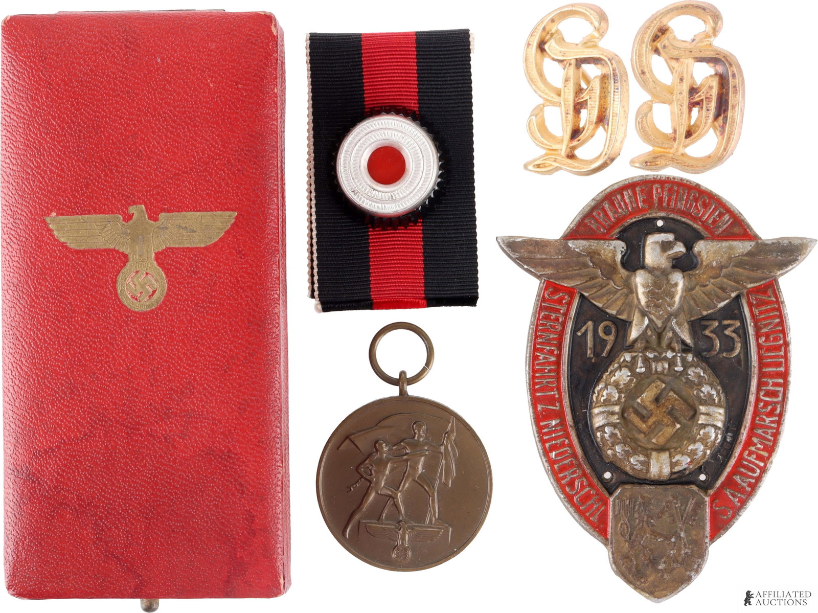 WWII Badges & Pins Lot of 5 German Third Reich: A lot of five pieces of WWII German militaria and memorabilia. Includes the following: 1) a WWII German visor cap cockade measuring approximately 1 inch and weighing 3.9 grams; 2) a cased, non-fluores