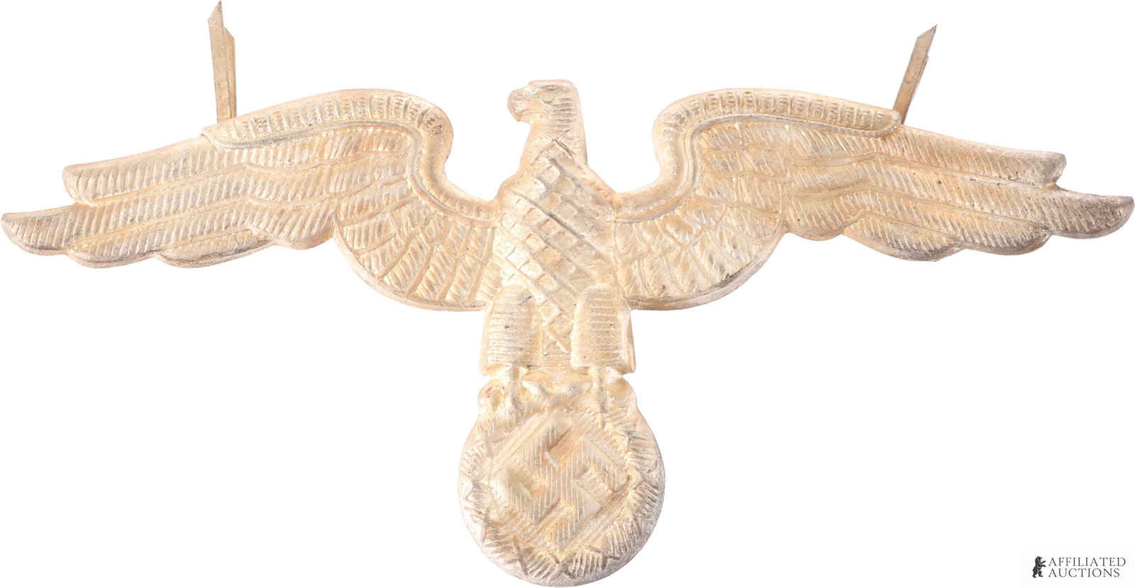 WWII German Diplomatic Corps Cap Eagle: NSDAP Office of Foreign Affairs visor cap eagle. Reverse is marked with an 'M.' It measures 4 5/8 x 2 inches. Dual pronged. Non-magnetic.