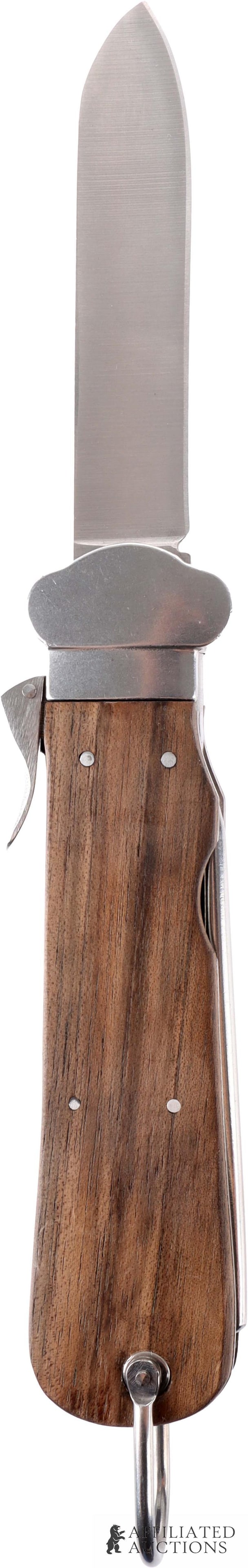 Fallschirmjager Messer Knife WWII German: A fallschirmjaeger gravity knife (Flieger-Kappmesser). Wood grips, incised arrow mark, and spike for disentangling parachute lines. This knife was produced by At the Front, and has their usual high qu