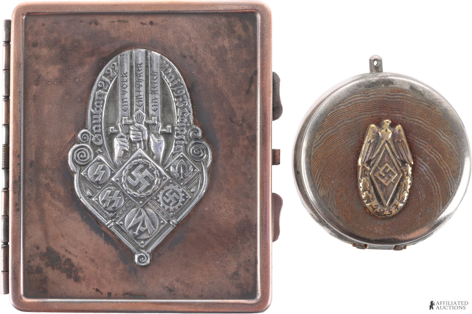 Cigarette Case & Ash Tray WWII German Third Reich: A set of two (2) items from the German Third Reich. 1) An ash tray with the Hitlerjugend symbol of a diamond-enclosed swastika. 2) A cigarette case with a mix of symbols, including NSDAP, RAD, TeNo, S