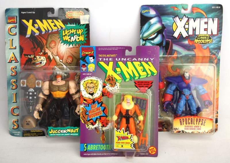 THREE X-MEN MINT IN BOX ACTION FIGURES: This group includes the X-Men After Xavier The Age of Apocalypse "Apocalypse", the X-Men Classics Juggernaut with light up weapon, and Th Evil Mutants The Uncanny X-Men Sabertooth includes trading car