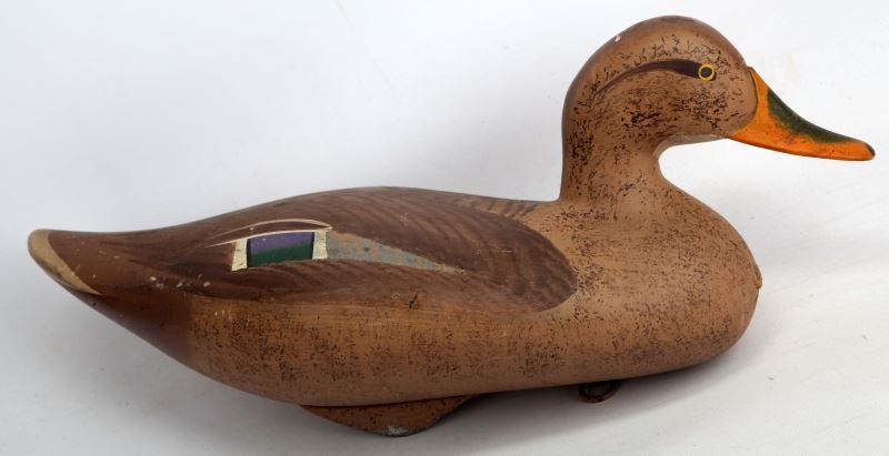 ONE NORTH CAROLINE HANDMADE WOOD DUCK DECOY: This decoy is hand-carved hand-painted wooden wood duck decoy. It was made in North Carolina. It has a metal anchor on the bottom and measures approximately 16.5 inches long and 8 inches tall (From to