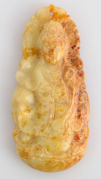 CHINESE CARVED SOAPSTONE BUDDHA: 8.5 by 4 cm yellow soapstone standing Buddha pendant. No chips, cracks, or detractions.