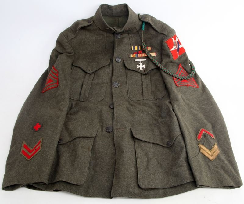 WWI UNITED STATES MARINE CORPS TUNIC: Tunic features a fourragère, original EGA buttons on the collar, and original buttons. Some parts appear to have been replaced. Overall in very good condition.