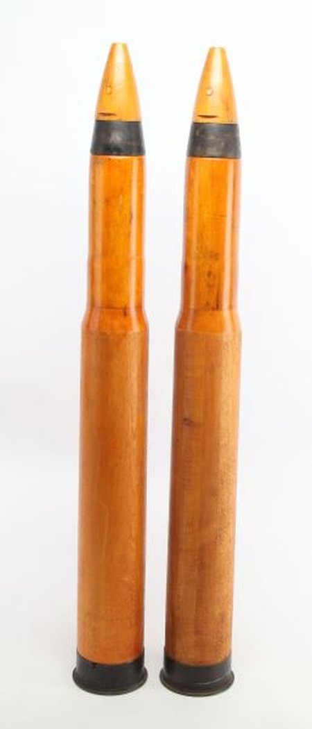 TWO LARGE WOODEN PRACTICE DUMMY TRAINING SHELLS: Two large wooden practice Mk 6 Naval dummy artillery training shell. Each measure about 35 inches long, and weighs just over 24 pounds. Very good condition