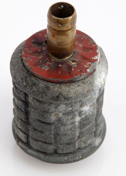 WWII JAPANESE TYPE 97 INERT GRENADE: The standard fragmentation hand grenade of the Imperial Japanese Army. The grenade measures 4 inches from bottom to top of fuse. Overall in good condition.