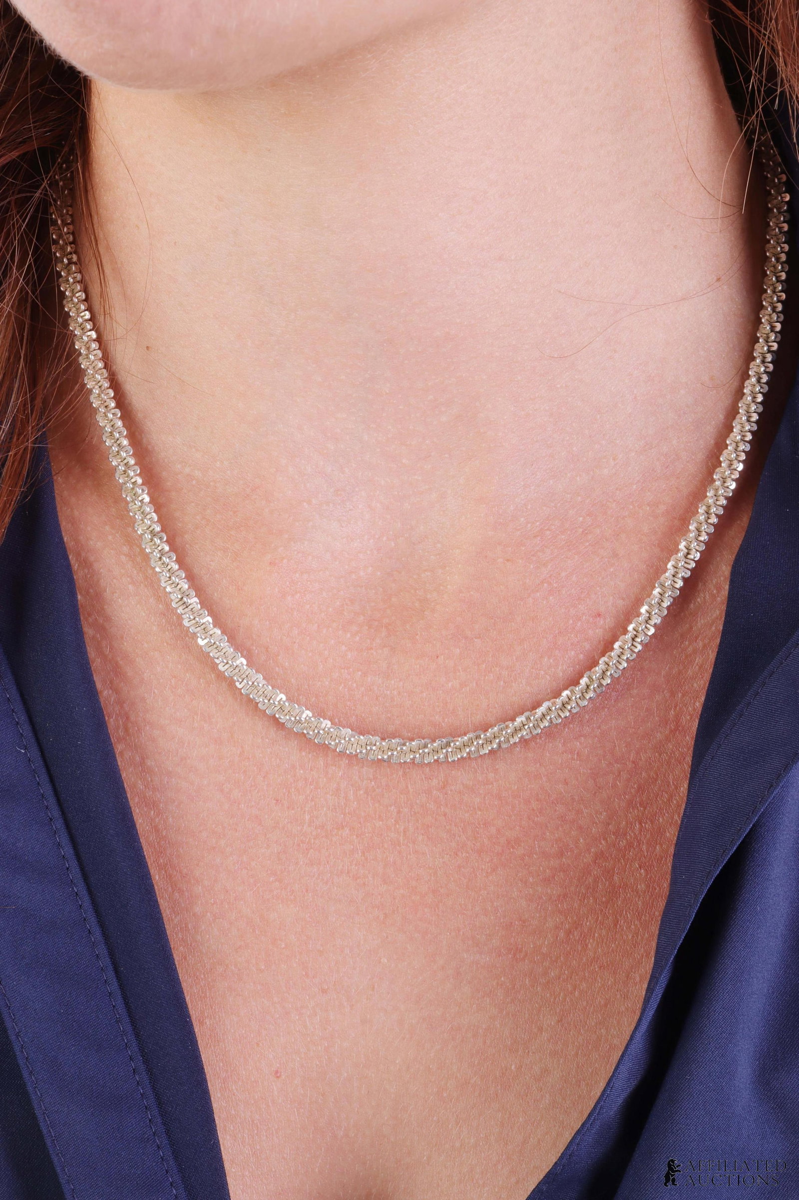 Braided Rope Chain .925 Sterling Silver Milor: A textured, braided rope chain necklace in .925 sterling silver from Milor. Stamped '925,' 'Milor,' and 'Italy.' Weighs 22.5 grams.