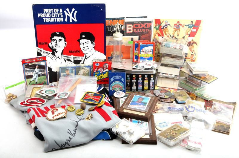 LOT OF VINTAGE SPORTS MEMORABILIA: Lot includes a Cincinnati Reds baseball jersey signed by player Wayne Krenchicki, a Shaquille O'Neal basketball jersey, boxing glove pins, a Budweiser bobsled team patch, 3 Topps baseball cards in ind