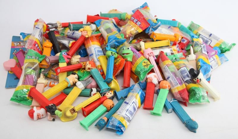 LARGE PEZ DISPENSER LOT WITH KERMIT SANTA AND MORE: 20+ PEZ dispensers from different franchises and time periods. Unsearched collection is in good to very good condition.